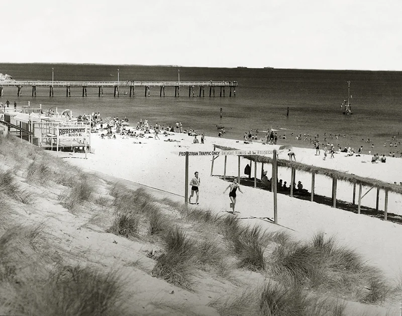 C17-Looking-north-to-the-jetty-from-the-Cottesloe-Surf-Lifesaving-Club-boathouse-and-Scoota-Car-track.-Marram-grass-planted-to-stablise-the-dunes-is-growing-in-the-foreground-1938.jpg
