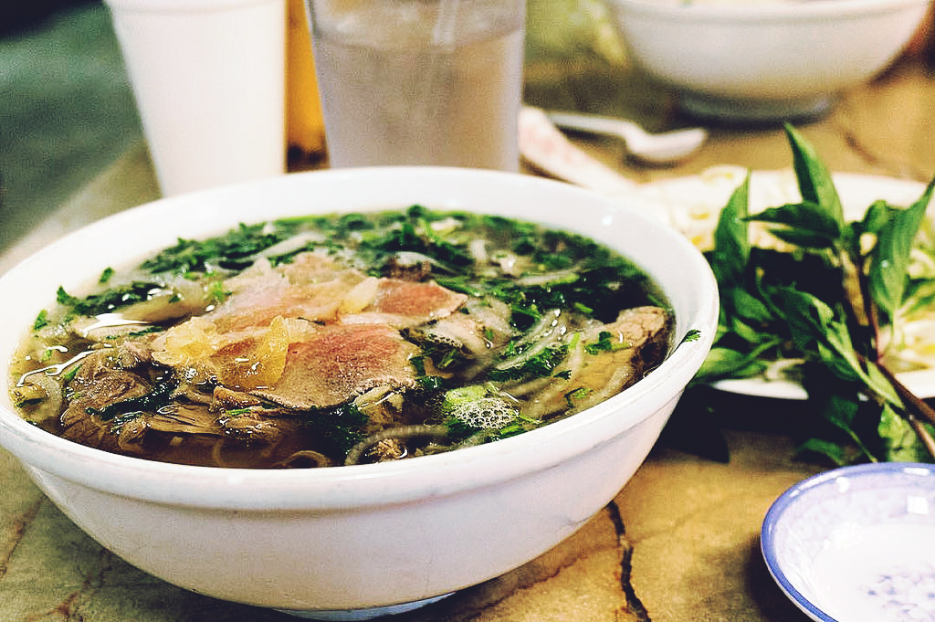 A bowl of phở with a side of Thai basil. (Photo: David Leo Veksler. CC BY-SA 2.0)