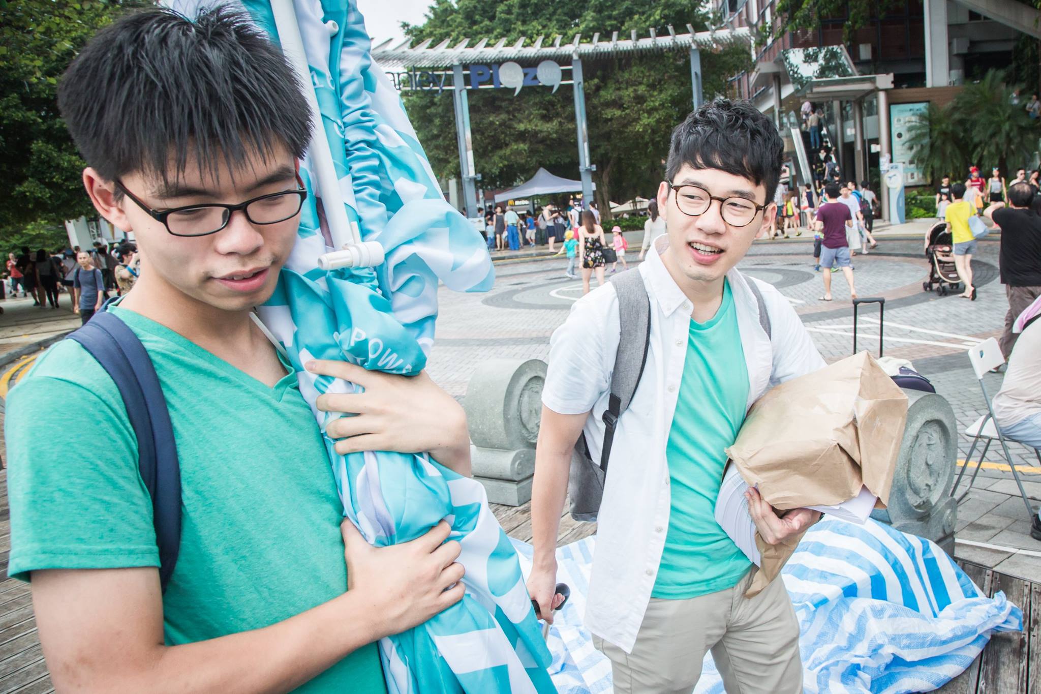 Joshua Wong (left) and Nathan Law (right) preparing to campaign on the street. (Photo: Facebook/Joshua Wong)