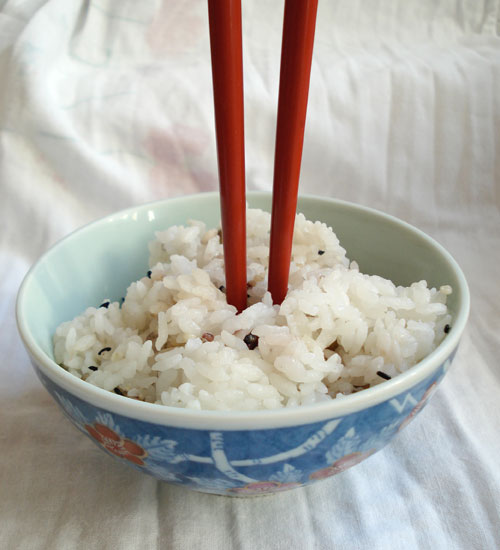 Sticking your chopsticks into your rice bowl like this is a major no-no at the Vietnamese dinner table.
