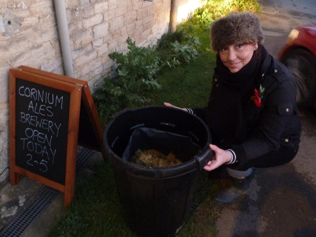 Vicky collecting the hops for her allotment compost heap