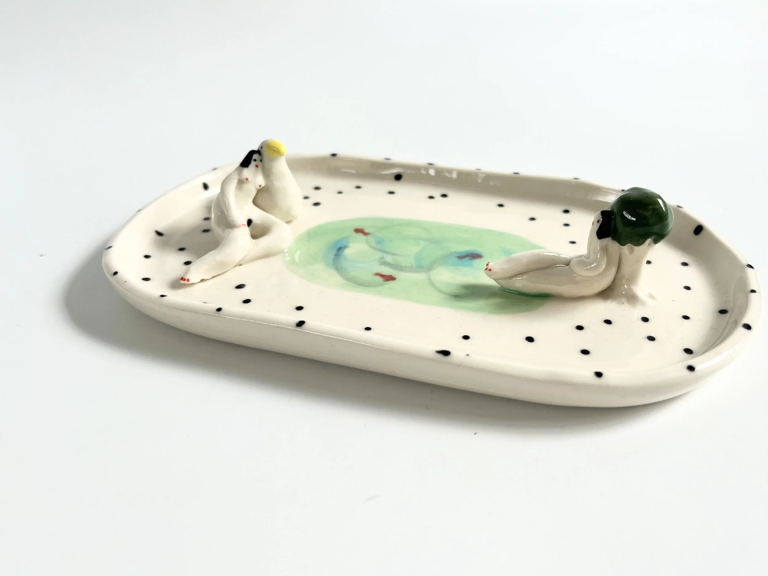 Oval porcelain soap dish, with two relaxing ladies around a small pond