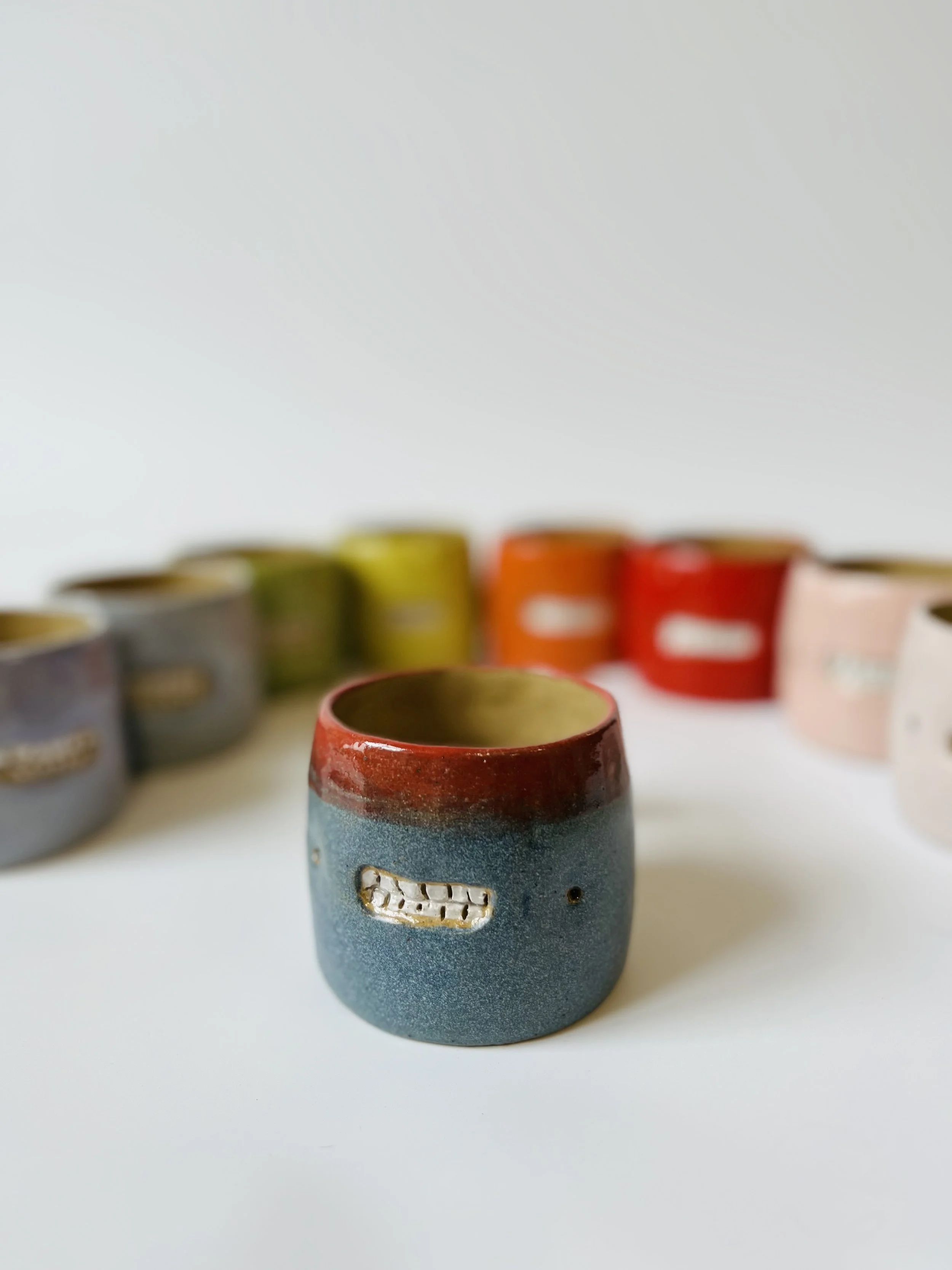 Shiny red and matt blue teethie mug, hand-built stoneware cup