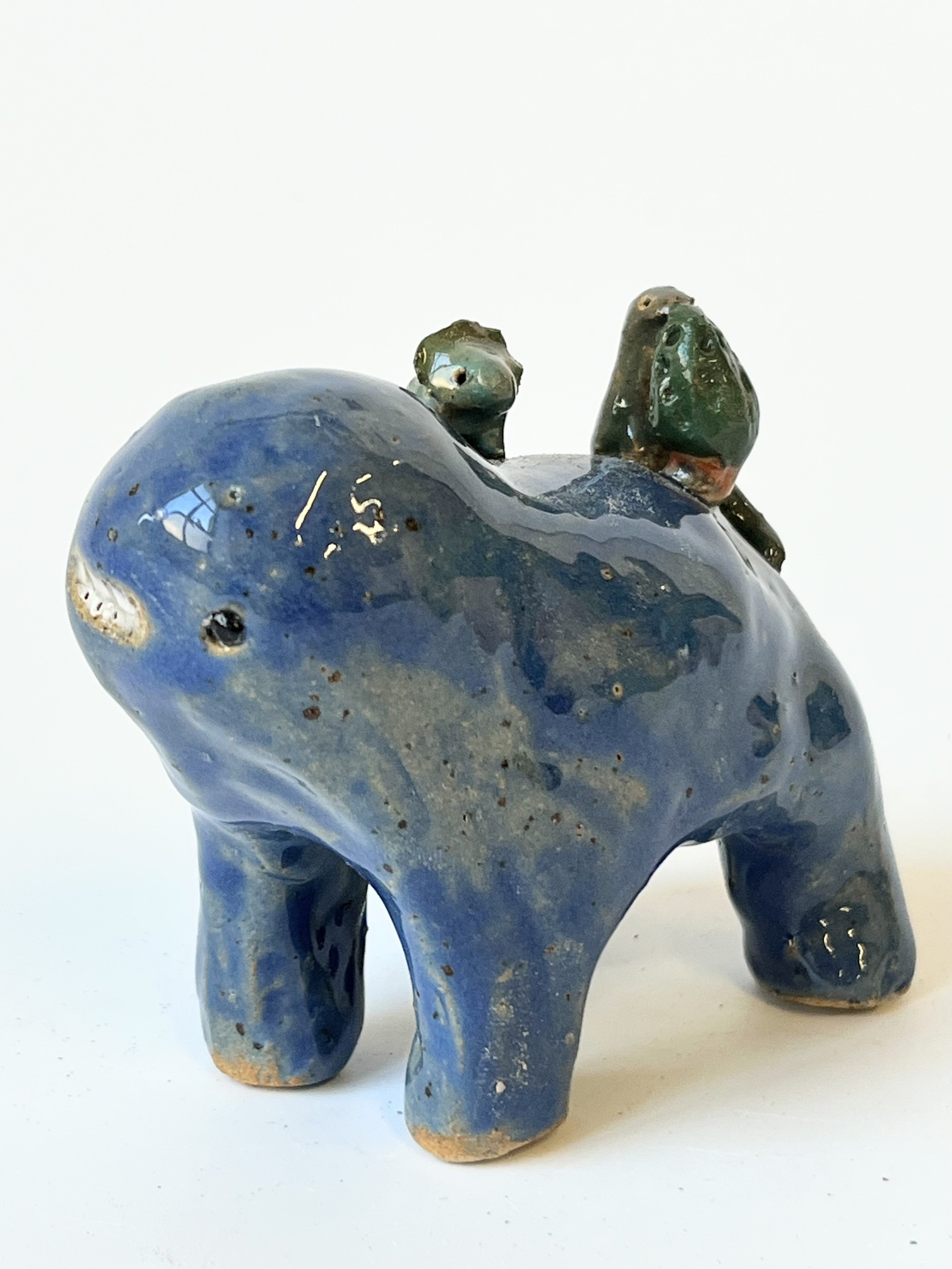 Mini Teethie, with little dinosaurs, one of them eating a tree