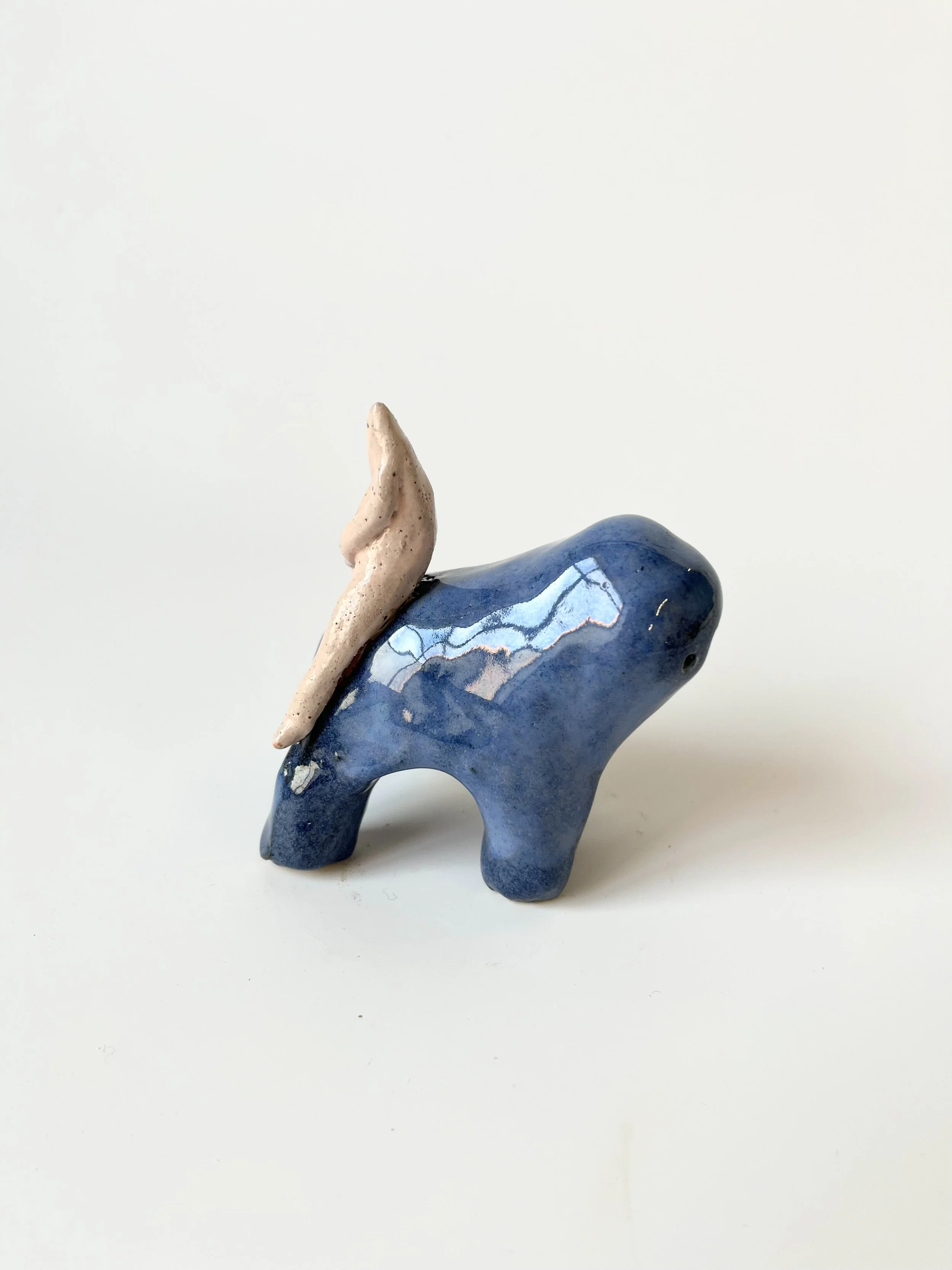 Mini teethie with a little sad man on its back