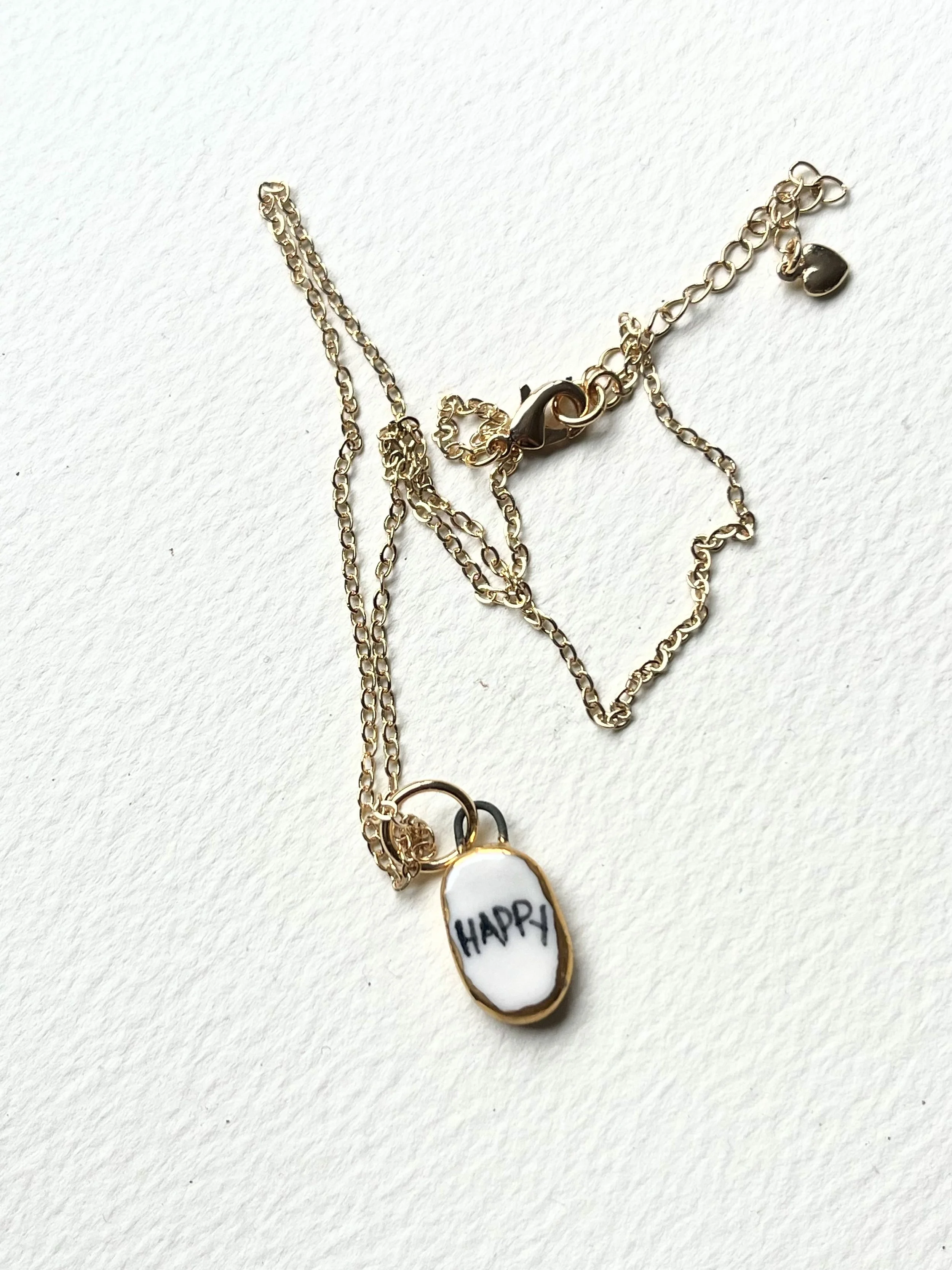 Porcelain oval "happy" pendants