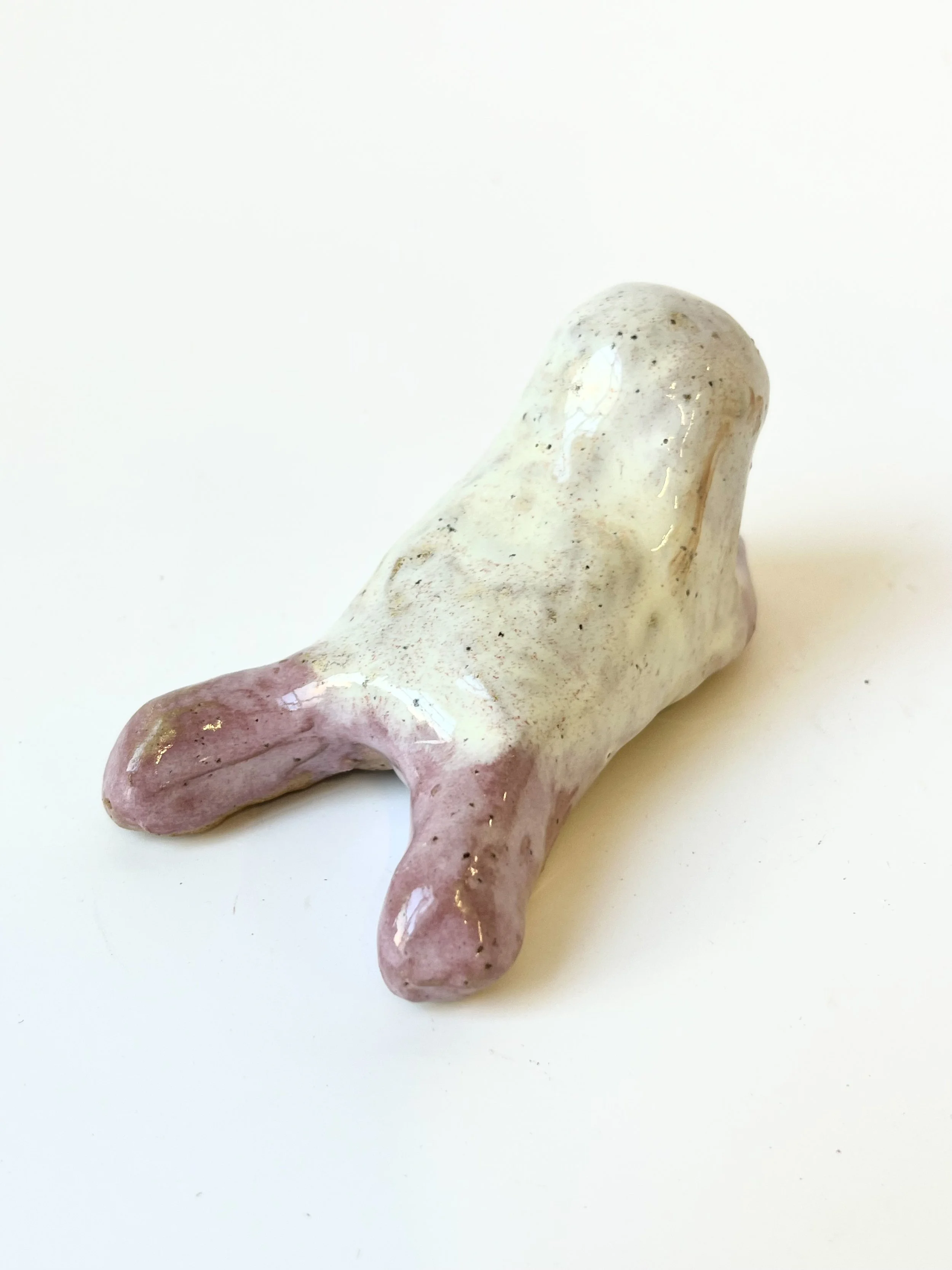 Mini Teethie, lying down, in a lovely lilac and very light green glaze combination