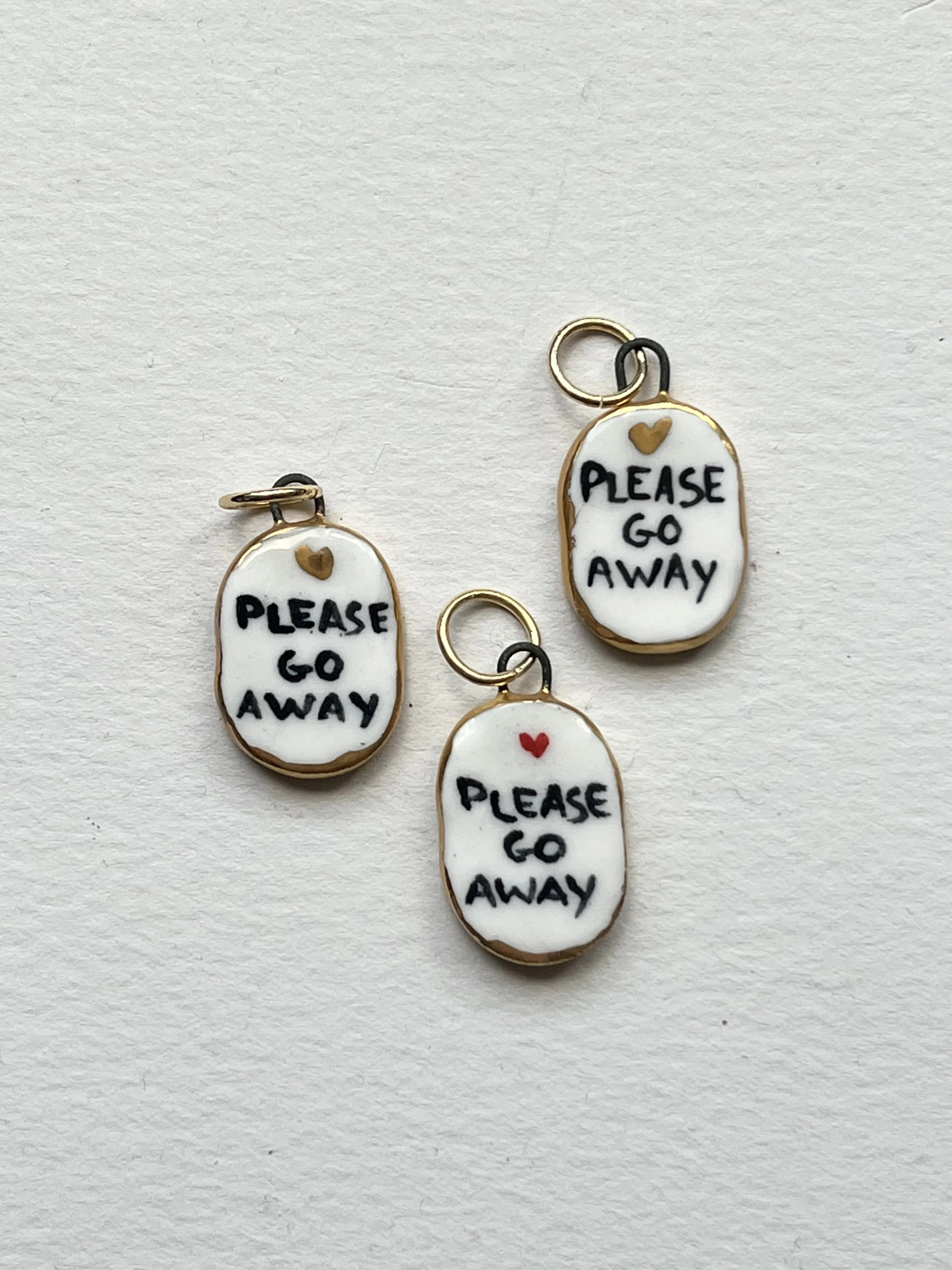 Porcelain oval "Please go Away" pendants with gold rim