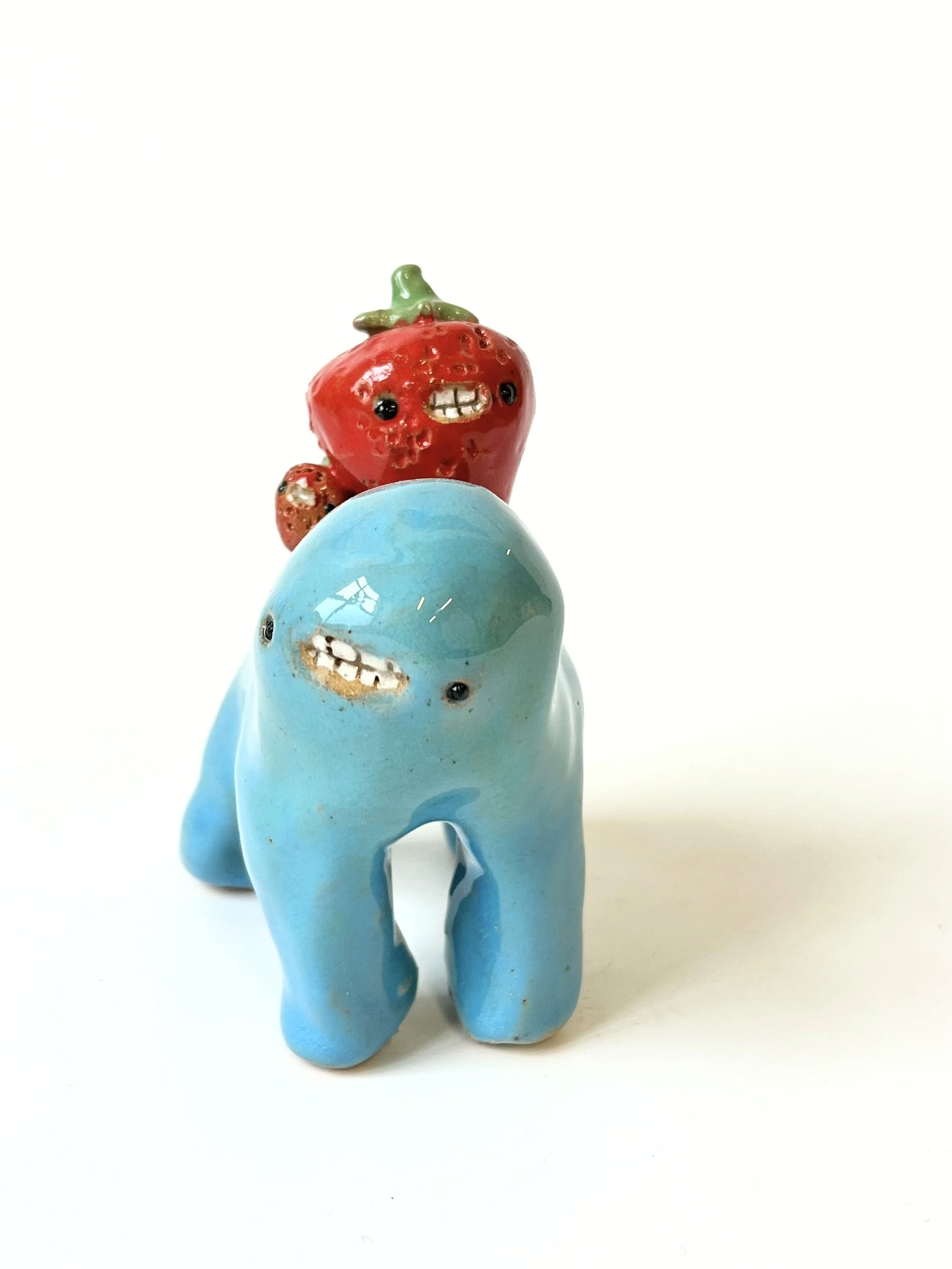 Mini Teethie, with two red delicious strawberries on its back