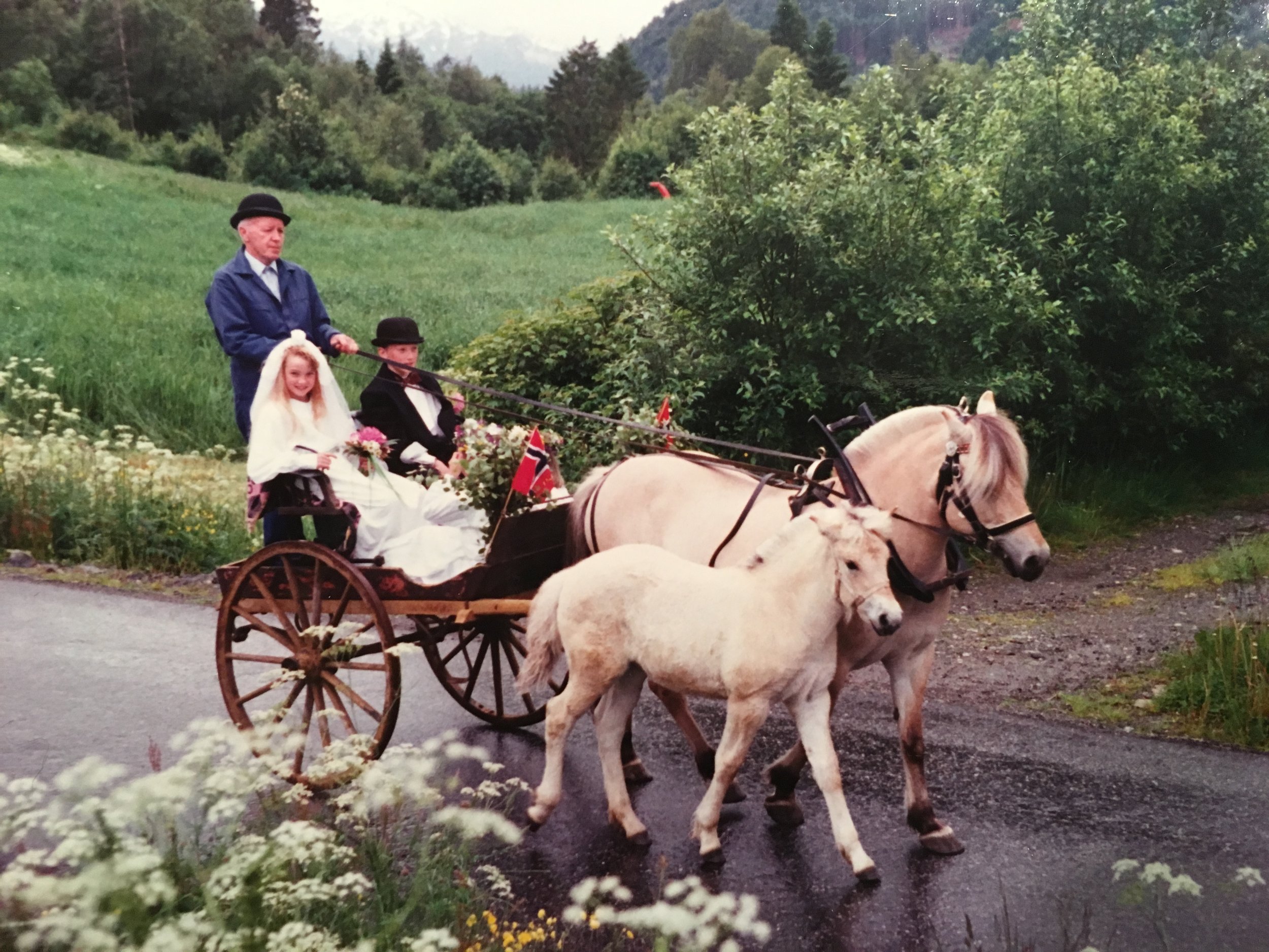 Me and next door neighbor Jenny as mid summer-newlyweds. Grandpa and his horses carrying us around.