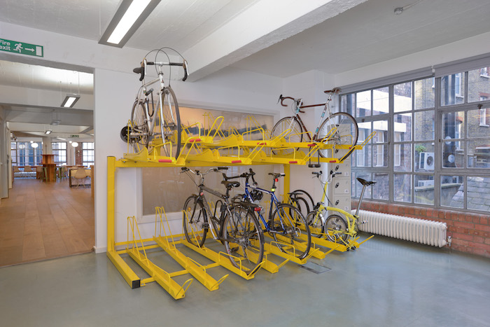 OUR TAKE: IDEO knew many of their employees cycled to work, but their previous bike storage was messy and insufficient. We incorporated a two-tiered solution that not only became an interesting and useful feature, it encouraged more employees to take up cycling to the office.