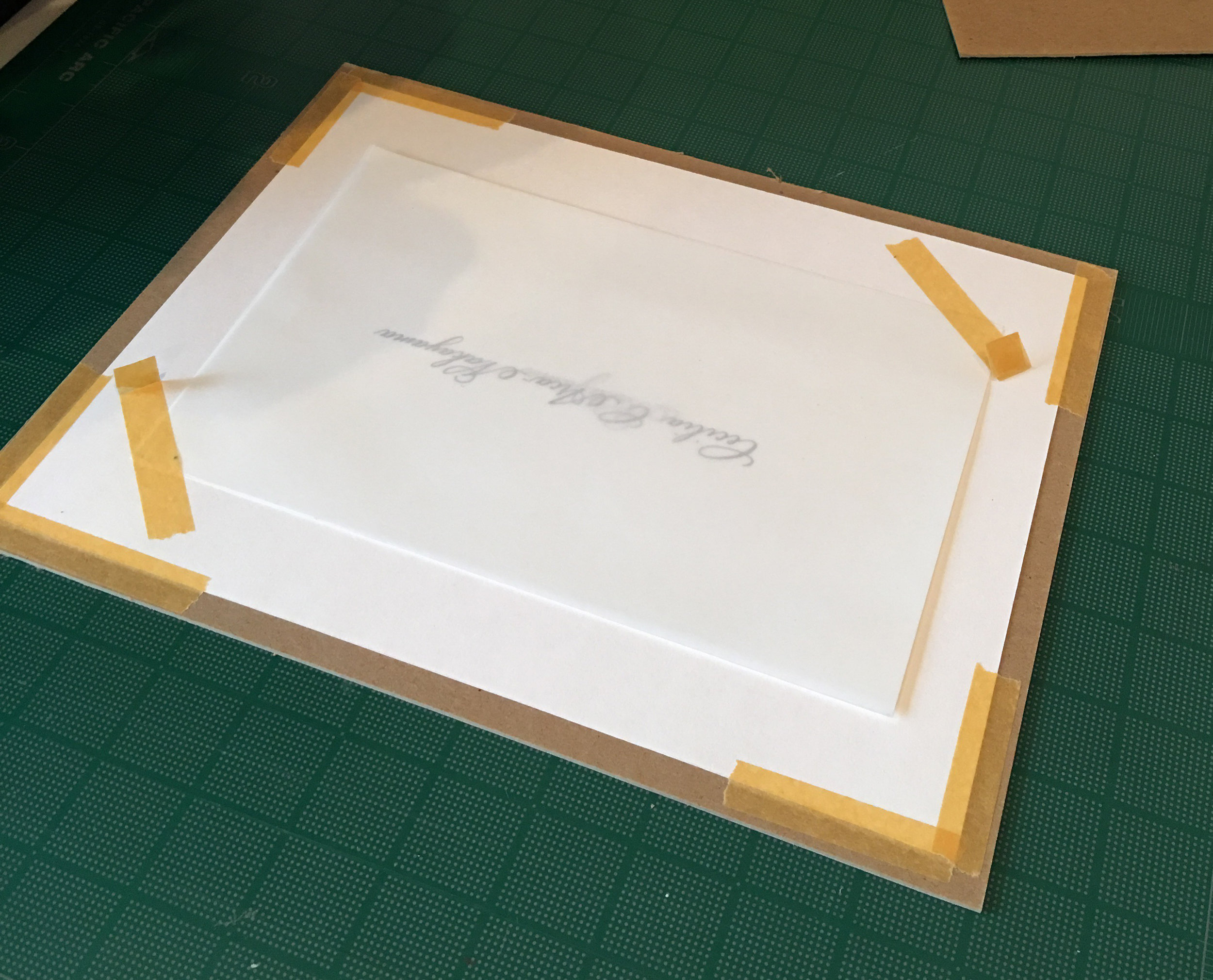 all corners are taped down to the cardboard