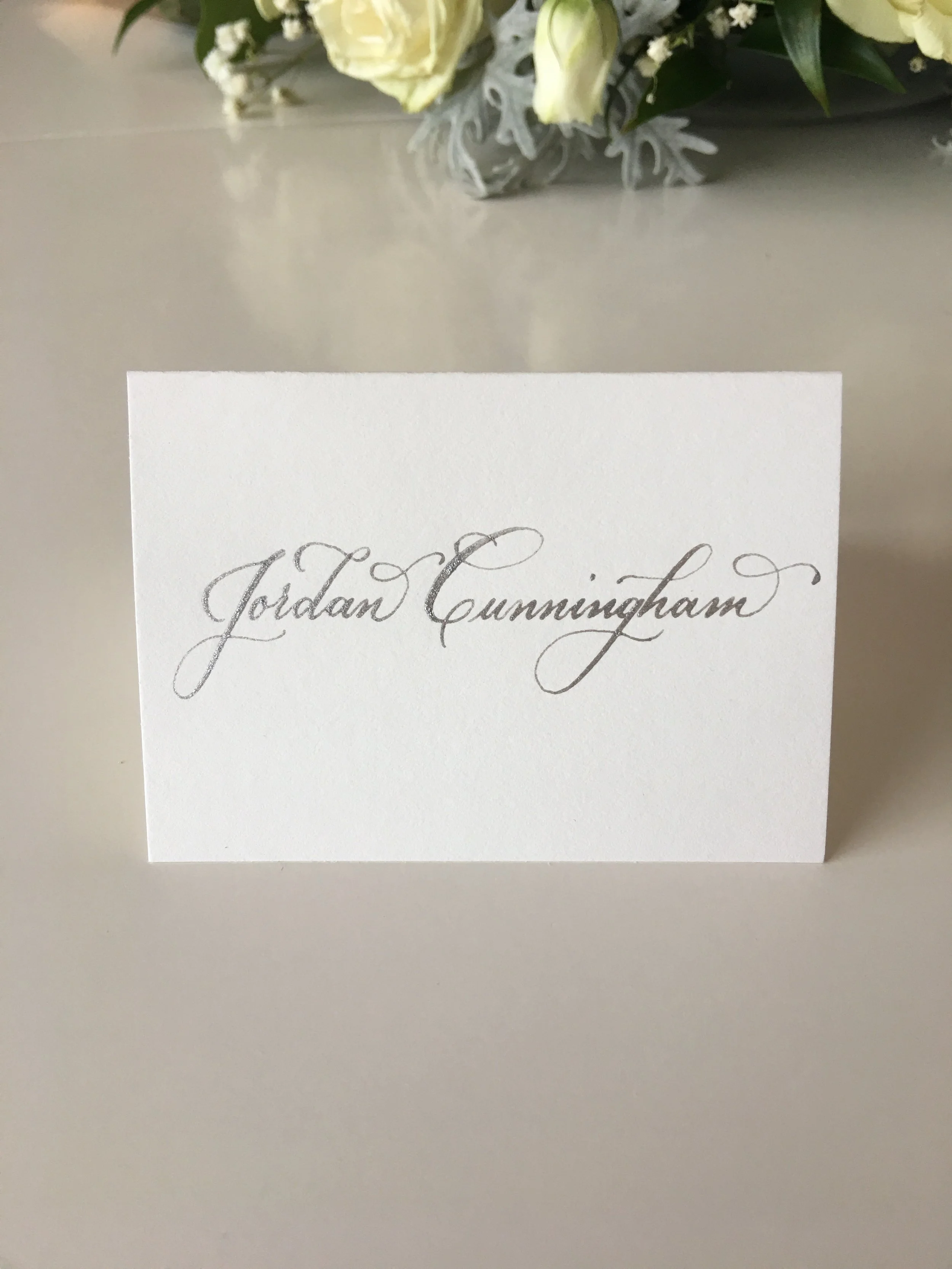 Full name on one line on place card.