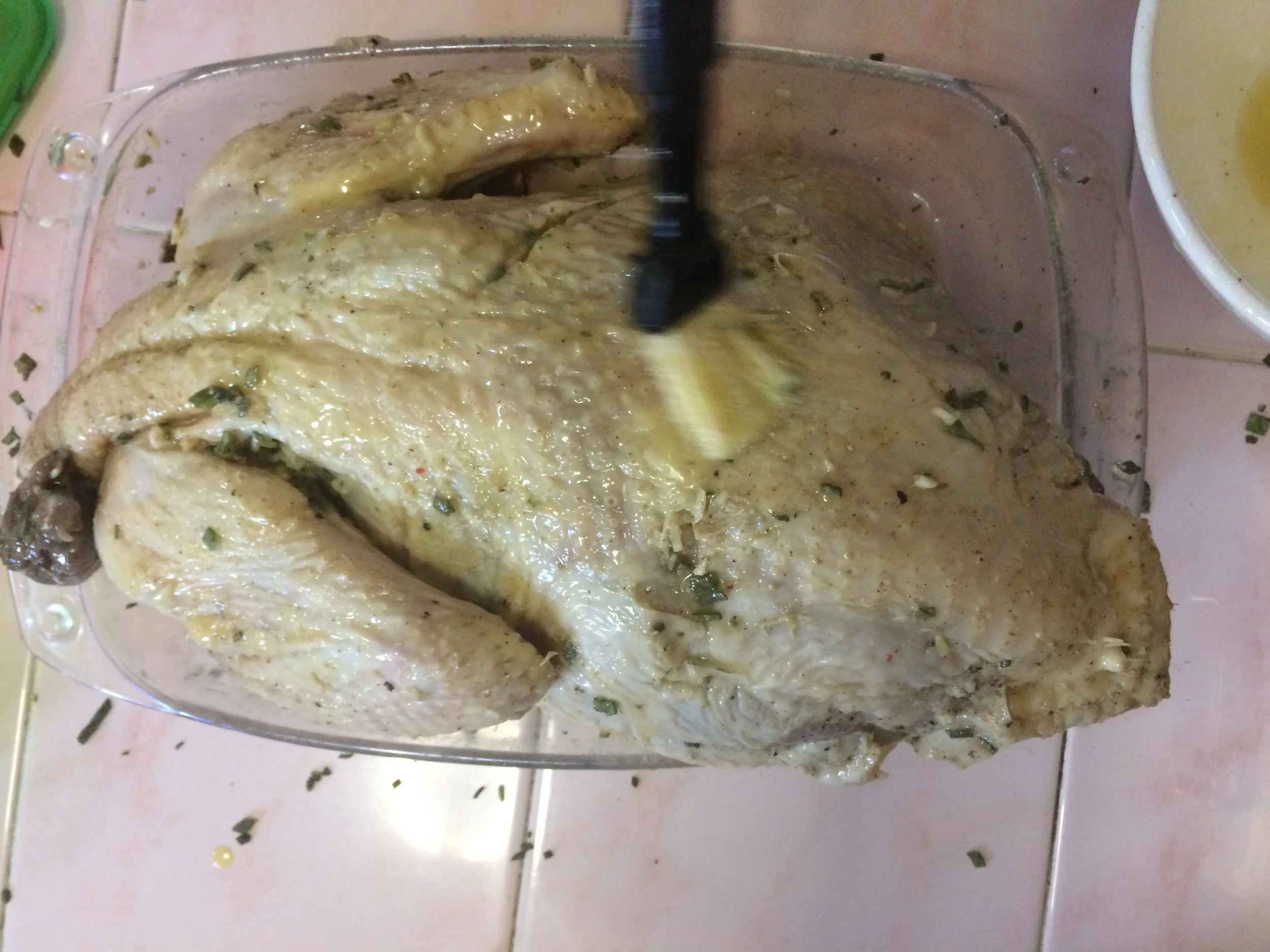 Brushing butter on my Cuban turkey before it went into the oven. 
