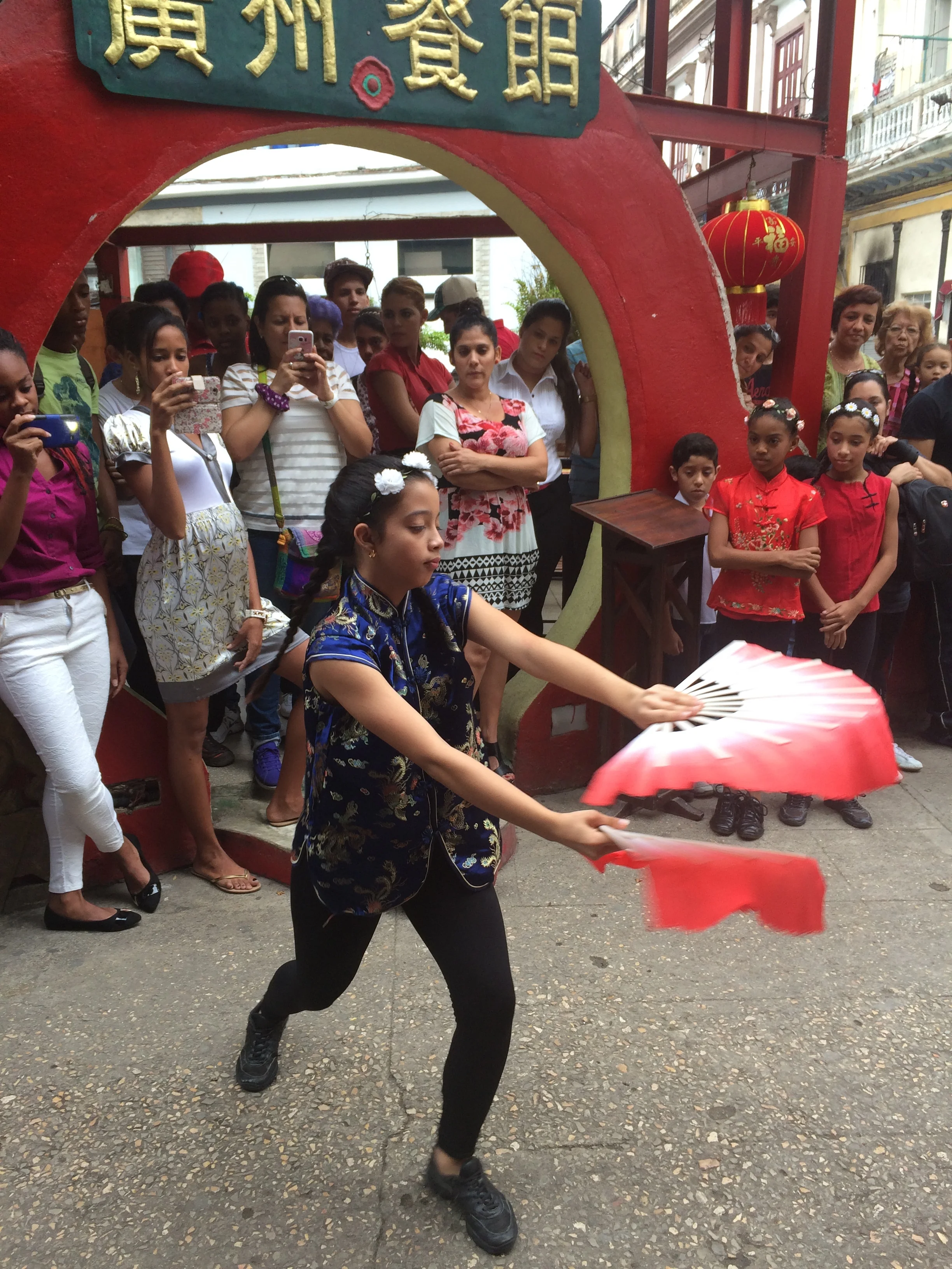 A student from the School of Wushu in Chinatown performs a fan dance. 