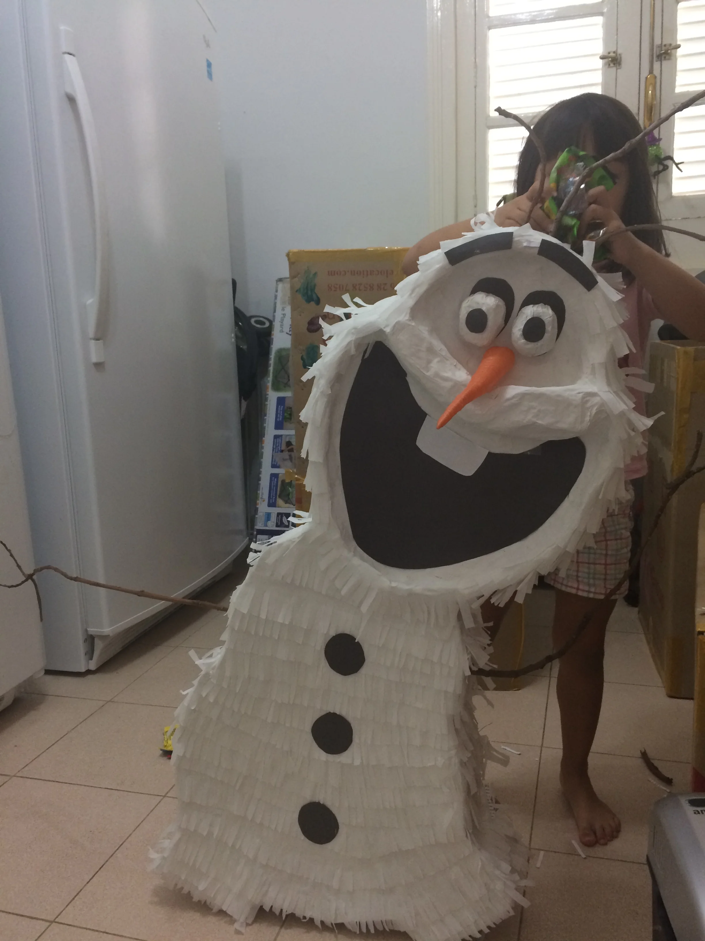 Stuffing our Olaf piñata with candy brought over to Cuba by "mules." 