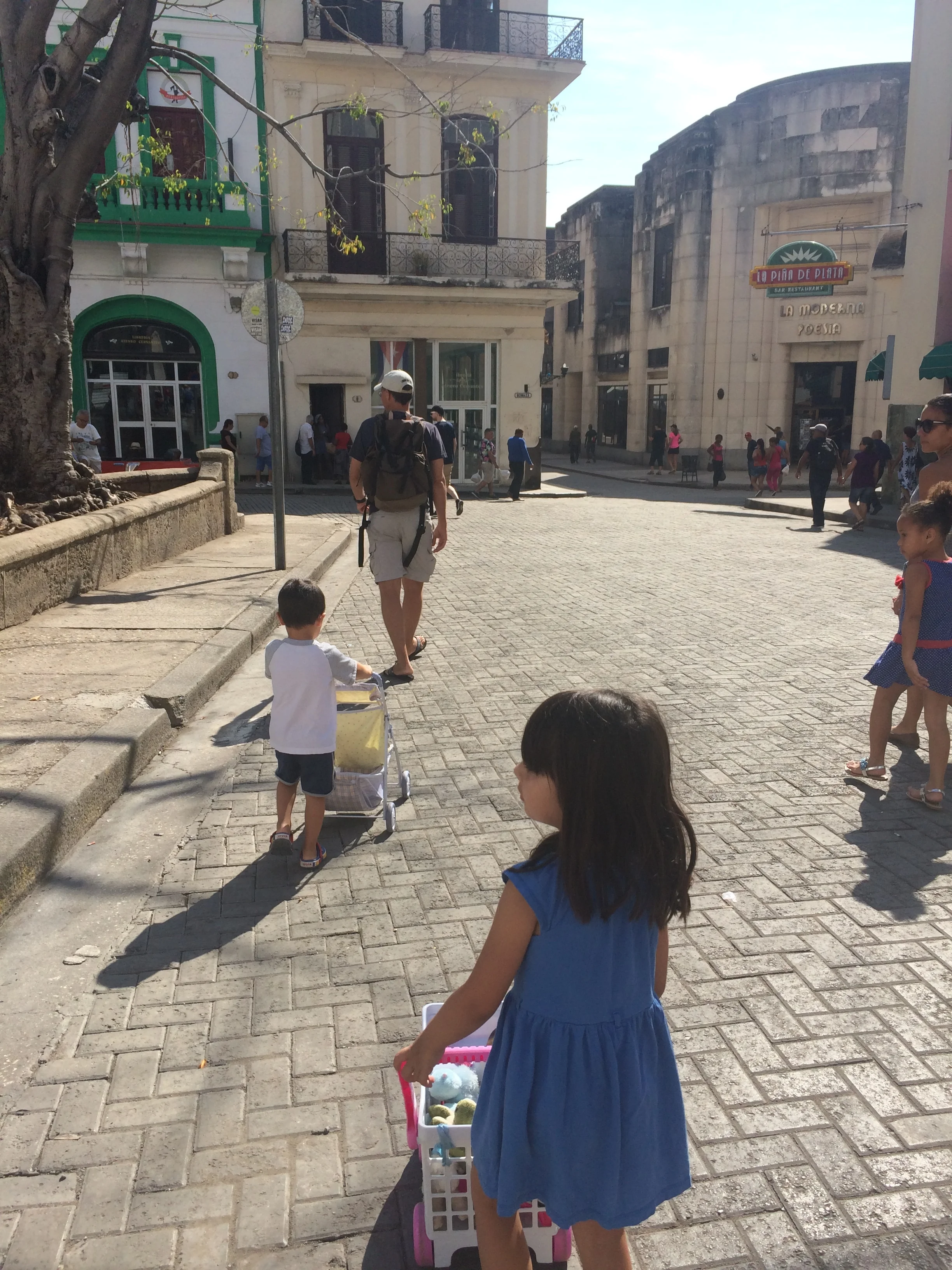 Our kids, now aged 3 and 5, pushing their dolls around in Old Havana. 