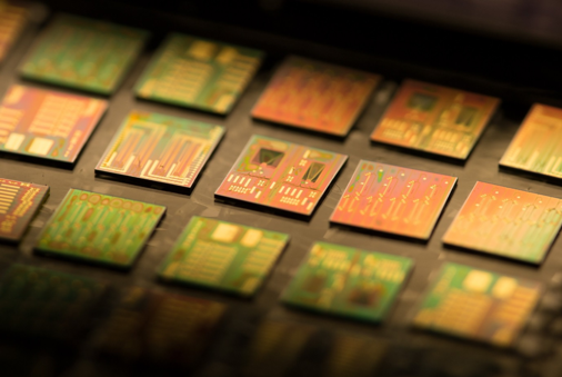 Example photonic integrated circuits produced on the indium phosphide platform for sensing and communications applications
