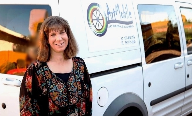 ArtMobile: Art that Heals on Wheels Is a visiting community-engaged arts and health program designed to reach under served populations in SW Arizona. The program provides weekly, participatory art classes to individuals who would not have the opportunity to engage in a creative experience. A vehicular mobile “art cart” (van), is used to transport an artist, art supplies and arts curriculum customized to the needs, interests and abilities of the targeted participants and partnering organizations. The program partners with various healthcare, community human service, art and city government organizations to facilitate art classes with participants of various ages, 4 -94 yrs old. The primary focus populations are individuals of various ages with mental and physical disabilities and older adults: independent still living in their homes, assisted living, memory support and long-term care centers. Group workshops include visual art, pottery, movement, and music along with individual sessions in bedside and in home art. Artmobile also partners with health and community centers to design and build supportive healing environments for their facilities. "Tiles of Compassion" ceramic healing wall and "The Garden of Oasis" healing garden are two projects the program created with the patients, their families and staff at a community hospital and a long-term care facility in Arizona. Aimed toward fostering lifelong learning, ArtMobile bridges quality participatory art classes into communities to promote personal creative expression, social inclusion, well-being and improved quality of life.