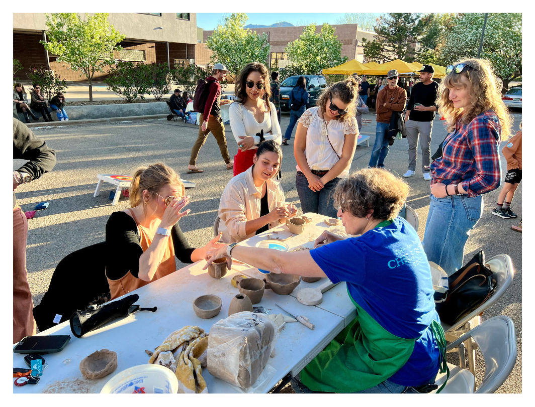  Attendees play with clay guided by Pottery Lab instructor, Natalia 
