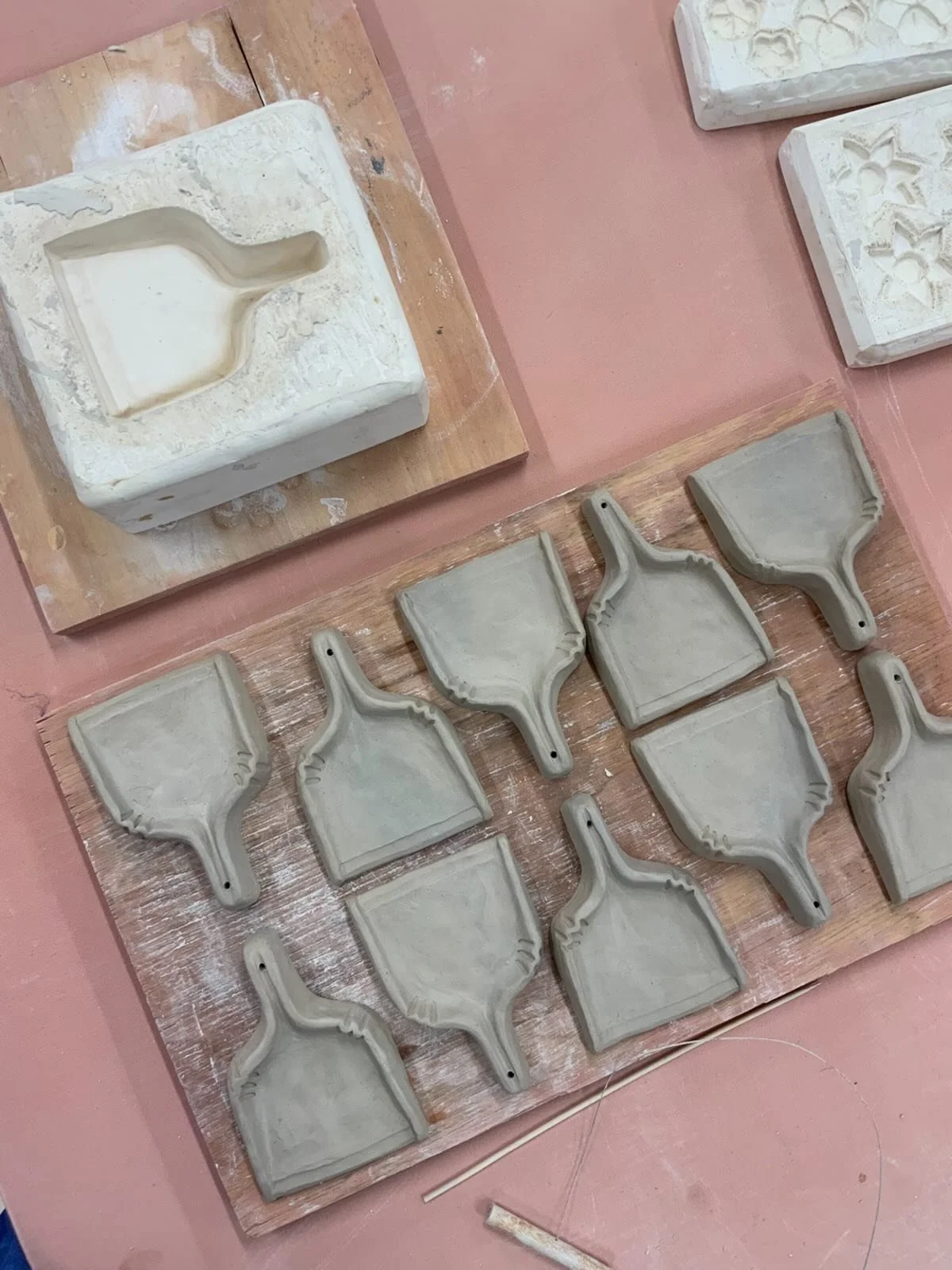 Studio day! Today is all about the dust pans. This was my first press mold the plaster is way too deep and I mixed it too thin, despite its heft it is brittle. However, because the plaster was poured so thin no air bubbles were trapped around the sha