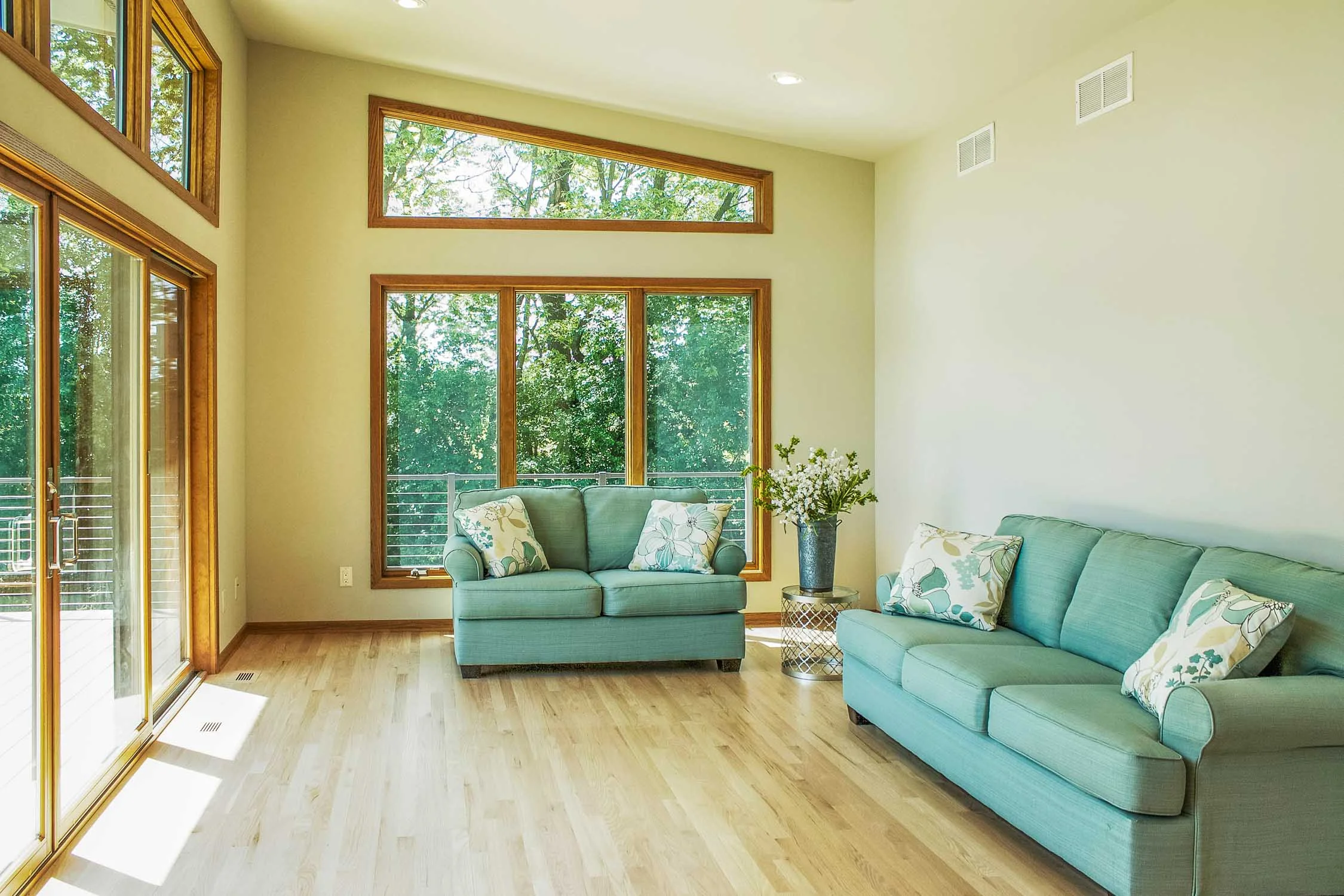 A Ranch Home Sunroom Addition With Expansive Glass Windows
