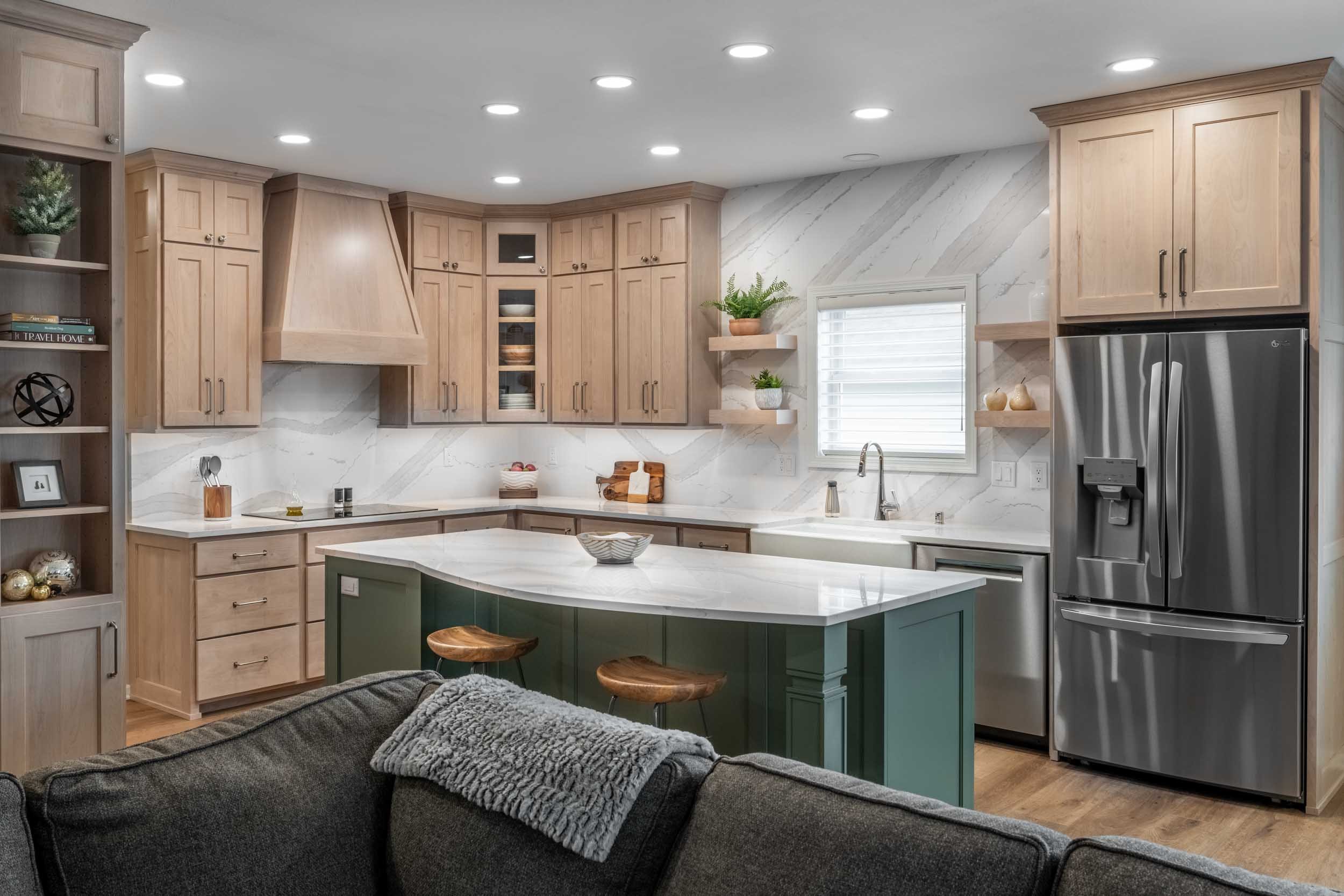 Green island, oak floor, alder cabinets, and white-grey quartz countertop