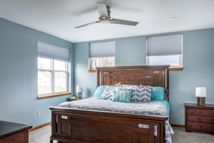 Transom windows above a bed