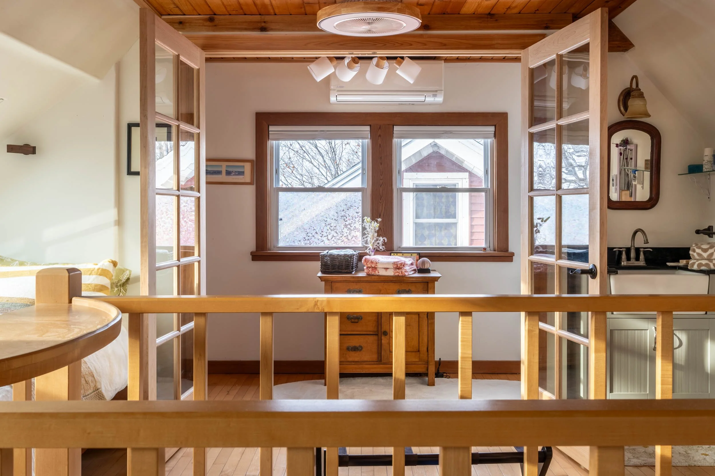 View of the entrance to the bungalow master suite with doors open.