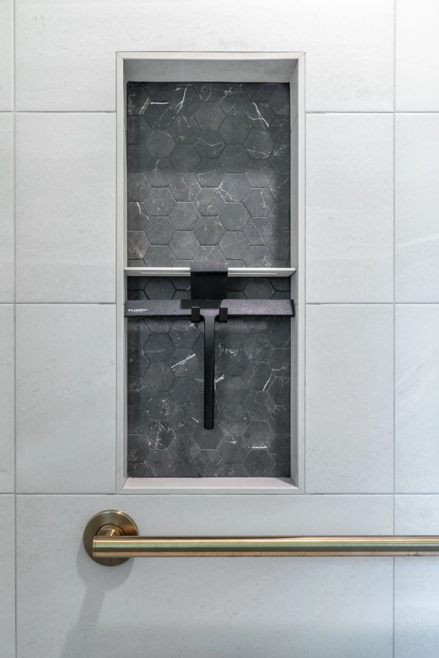 Close up view of the IntermateX mosaic tile shower niche