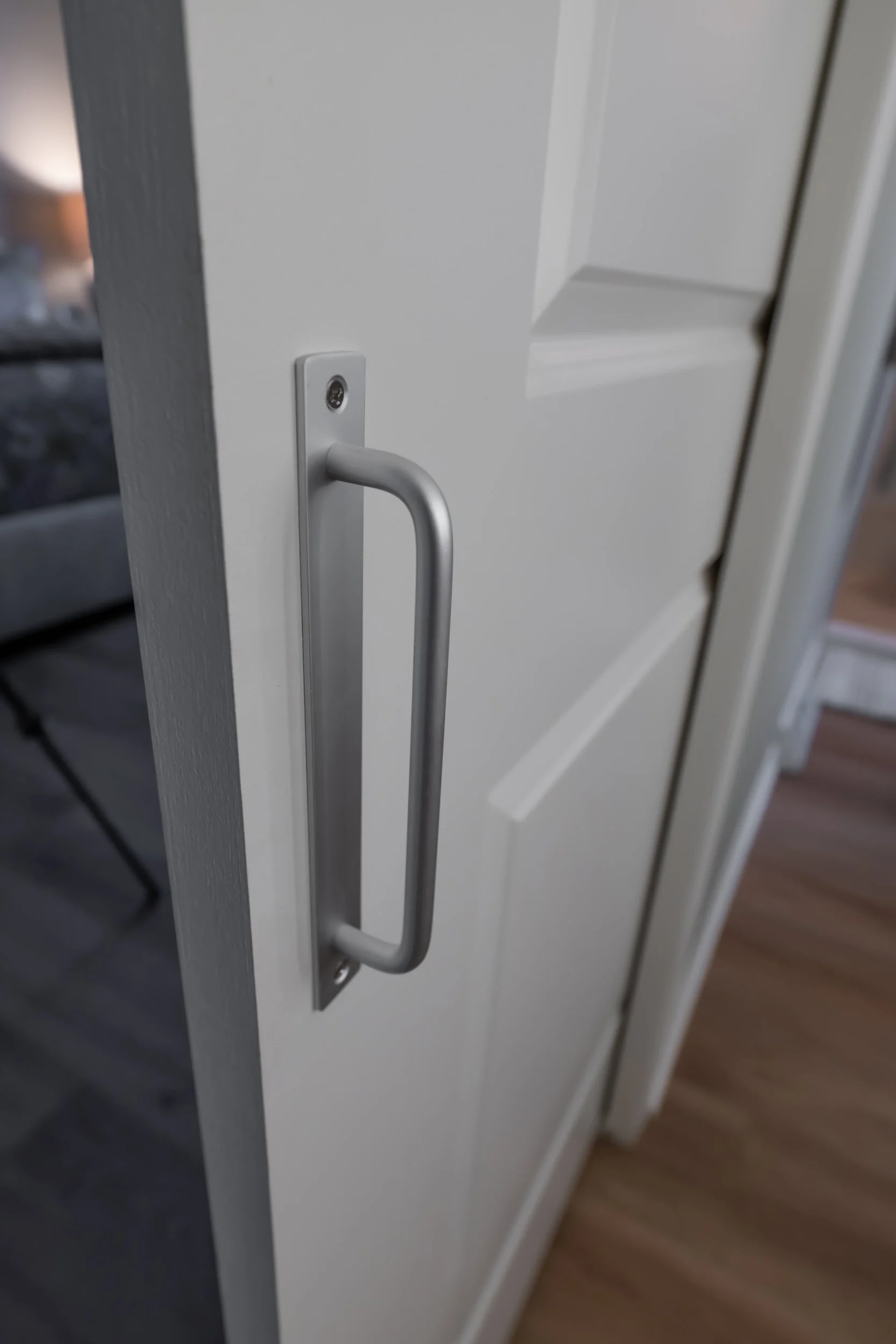The pocket door hardware is unique because it does not fully recess to accommodate the barn door.