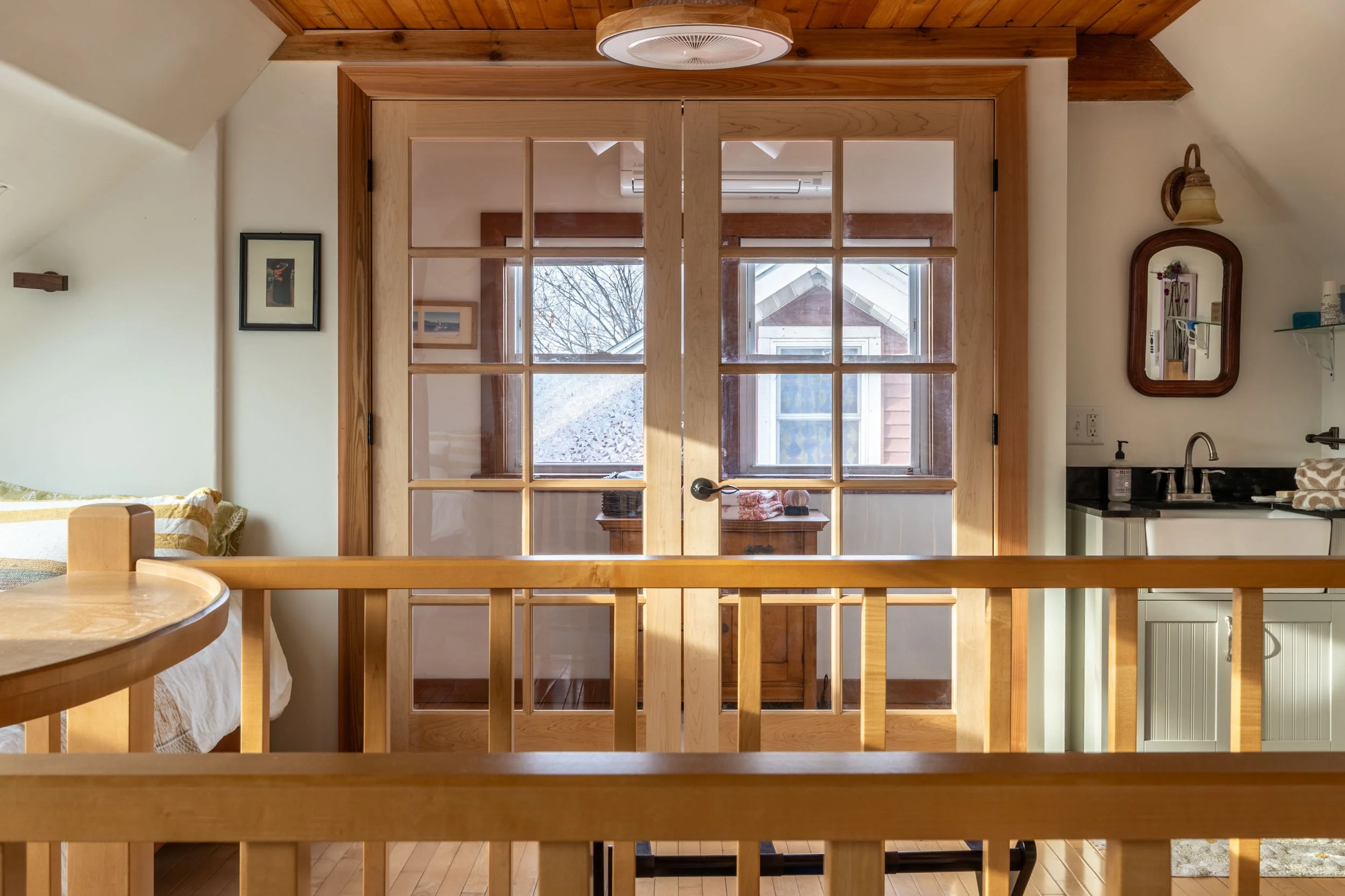 View of the entrance to the bungalow master suite with doors closed.