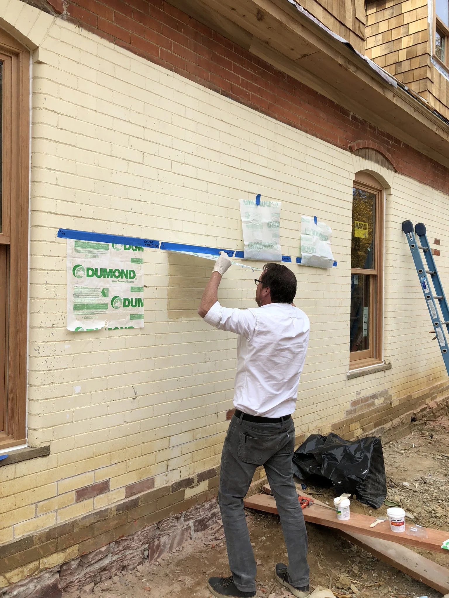 That’s me inspecting paint removal coatings on the old, painted brick