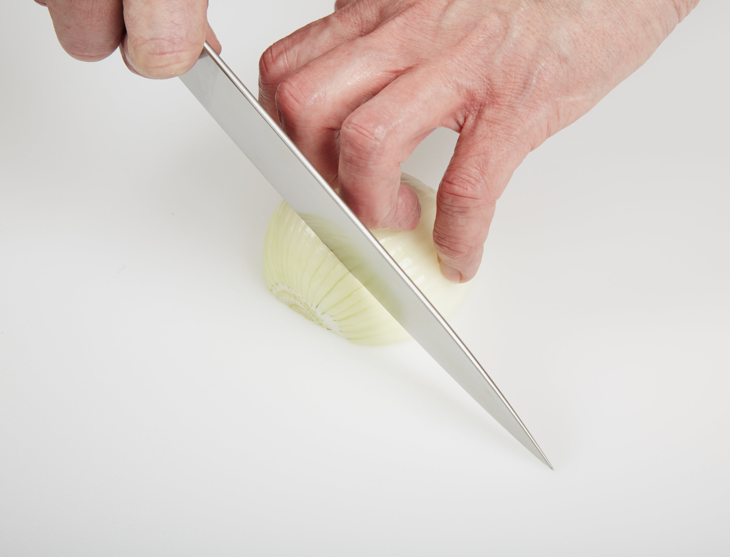Using a Guide Hand to Cut an Onion