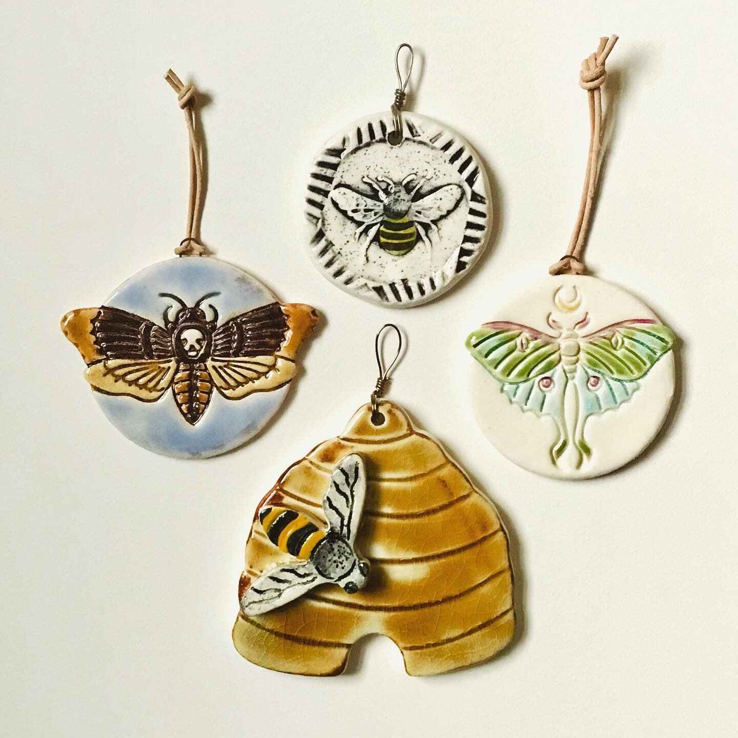 Honey bees, deaths head hawk moth, and  luna moth. I guess you could call this my bug collection? #claymoth #honeybee #lunamoth