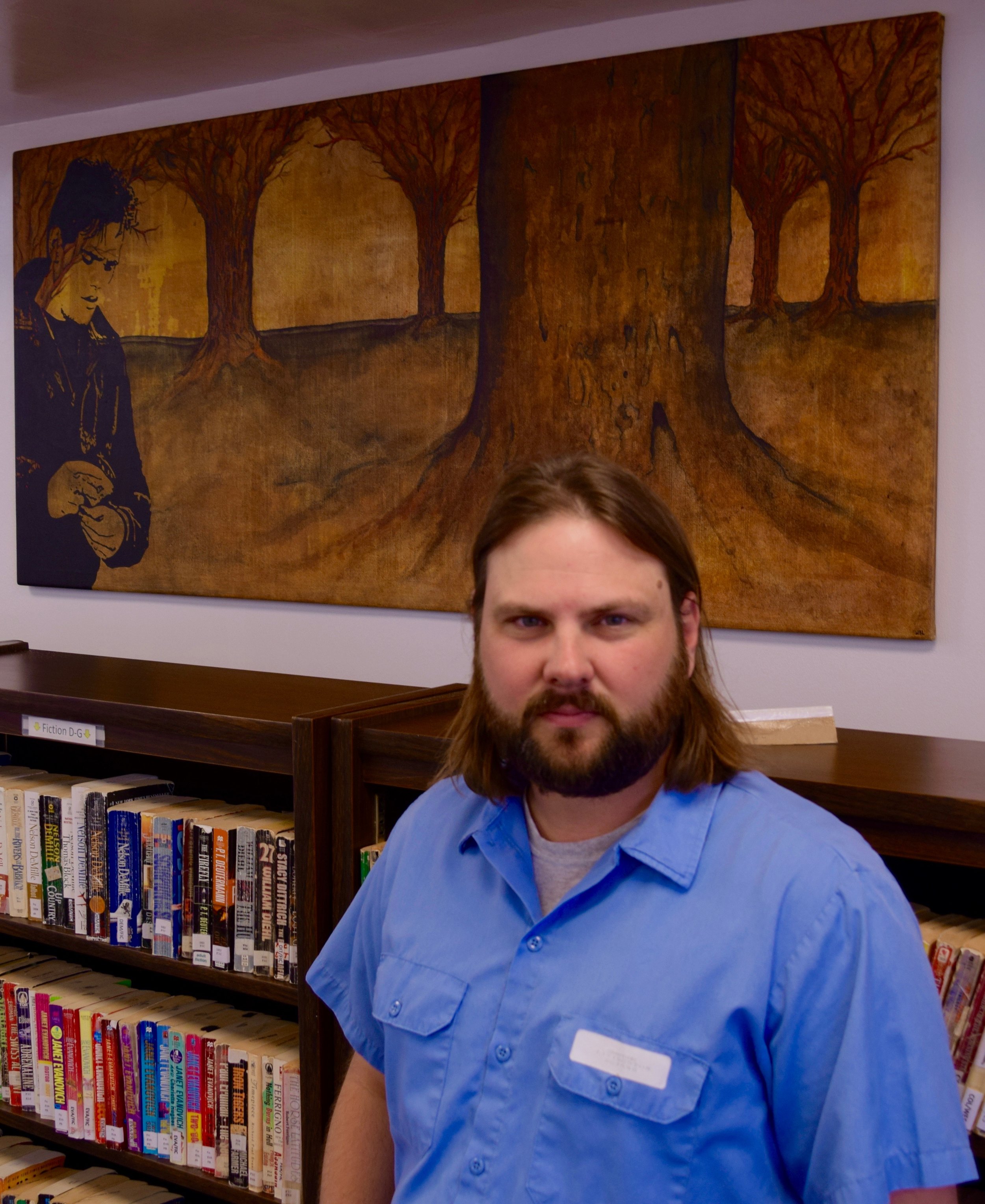 Livingston in the library with one of his paintings in the background. Photograph: Adrian Brune