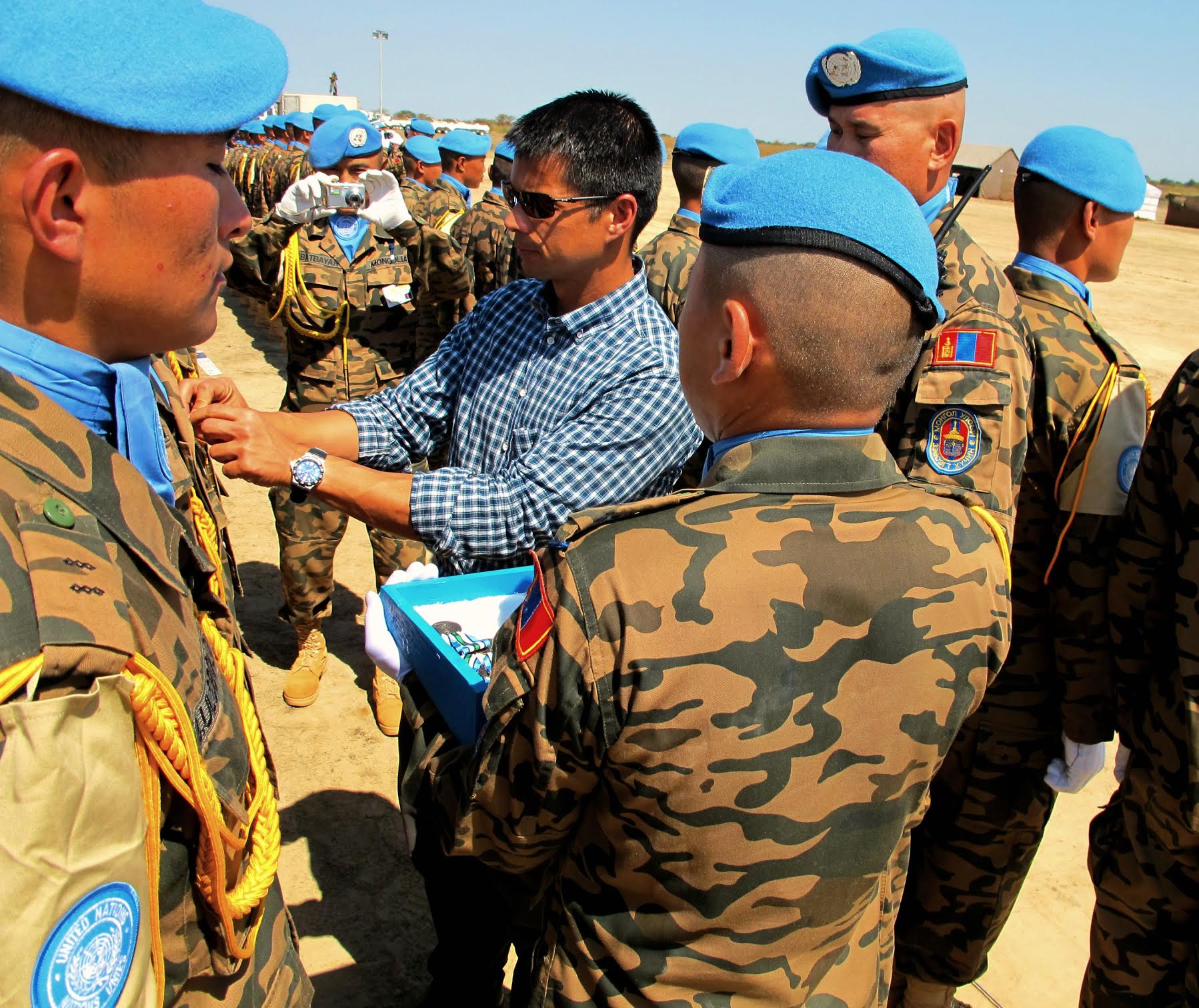 Payumo pins medals on Peacekeepers in South Sudan. SOURCE KEN PAYUMO