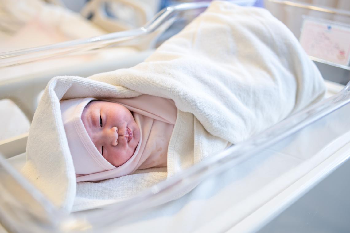 Beijing, China, 10:19 am: Li Xin Yao, 3.6 kg (7.9 lbs.), lies dressed and swaddled in the nursery of at Beijing United Family Hospital as her mother, Xu Hui, rests in her room. “It’s not easy to have a child over the age of 30, but I feel very fortunate,” says Hui, who underwent caesarian section for her second daughter’s birth. The Chinese government, with UNICEF’s support, introduced the Maternal Near Miss (MNM) and Neonatal Near Miss (NNM) Care Network Assessment and Development Project to save babies’ lives and improve child birth in China.