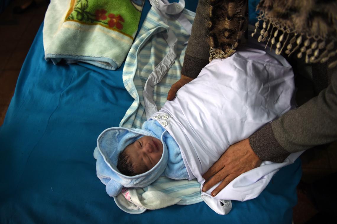 Kabul, Afghanistan, 9:00 am: Lemah Saleh, 24, welcomes Rayan, 3 kg (6.6 lbs.), at Malalai Maternity Hospital. Although life expectancy in Afghanistan is 65 years, “I pray that my son grows into a healthy and educated man to serve our beloved country and its people,” Lemah says. UNICEF works closely with the Ministry of Public Health to immunize every child with life-saving vaccines, keeping a ‘cold chain’ of refrigerators across the country to guarantee immunizations retain their potency.