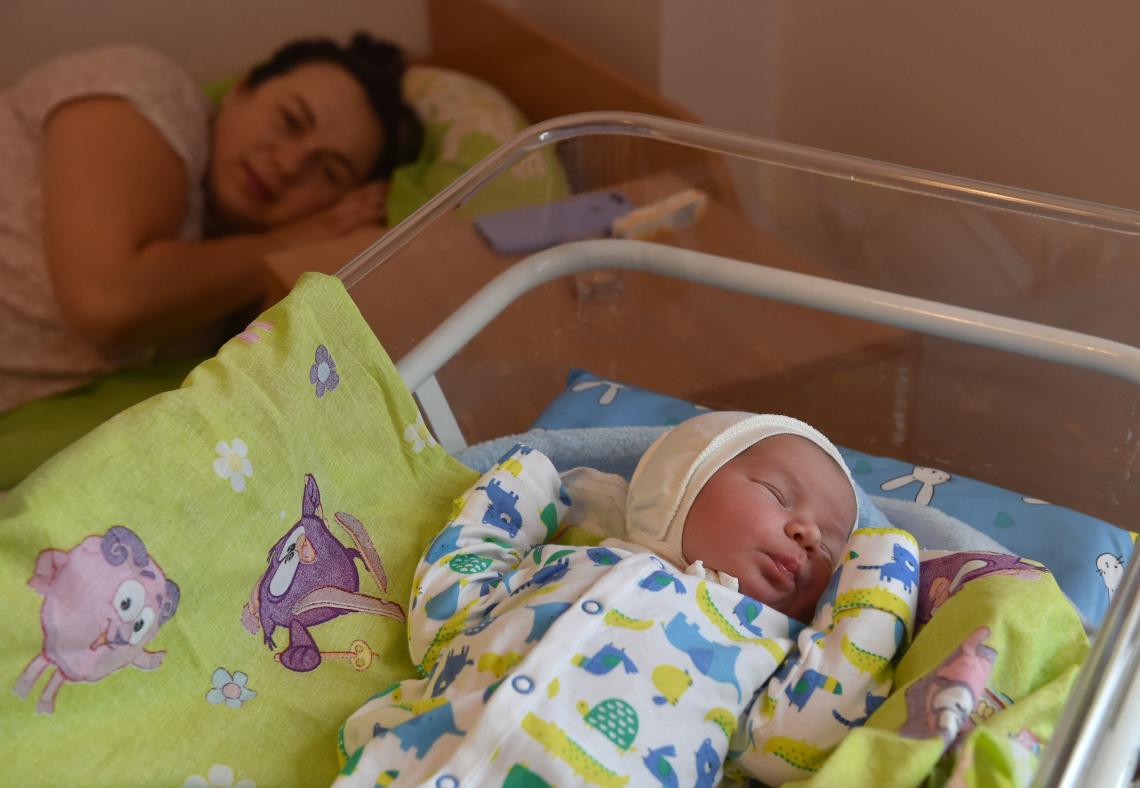 Kiev, Ukraine, 5:00 am: Iryna Dyshlevich, 31, lies near her baby, 3.9 kg (8.6 lbs.) at the Perinatal Centre of Kyiv. “He is a darling little man who, I hope, will love me for who I am,” Iryna says. In partnership with the Ukranian government, UNICEF established 11 modern parenting rooms in health facilities in two key provinces, providing improved access to basic hygiene practices, privacy for breastfeeding and informational materials on childcare.