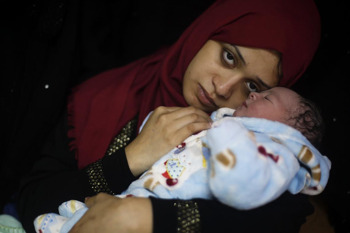 Gaza City, State of Palestine, 7:30 am: Samia cuddles her newborn baby boy, Mohammed, 3.8 kg (8.4 lbs.) at Al Shifaa hospital. “Nothing can describe how happy I am, but I’m worried about my baby’s future,” Samia says. As a result of the political crisis, the degradation in the water, sanitation and hygiene infrastructure and the energy crisis in Gaza persists. UNICEF has continued to provide safe drinking water through solar power water tanks, drinking water taps and hygiene instruction.