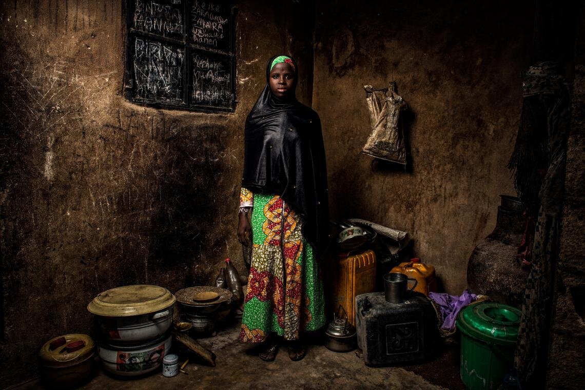 Four years ago, violent militias attacked Banki, Nigeria, the village where Bintu Mohammed, 13, lives. “I was in school in the morning and then I went home and… we ran, everyone ran,” she says. “They burned the school down. I was so upset, I felt like my dreams would never be achieved.” After returning from two years in Cameroon, Bintu enrolled in a rebuilt school. “I’m so happy to be back… I will be educated,” Bintu says standing in her home on 1 May 2019.