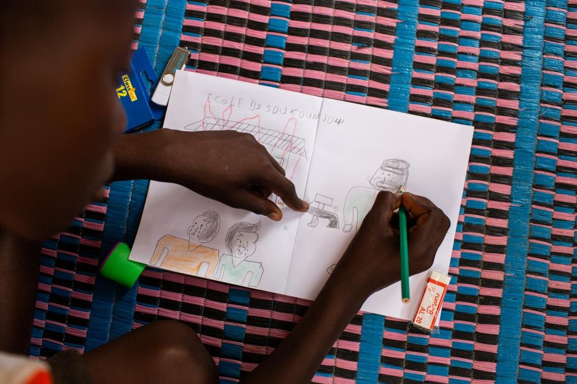 “My father said we have to leave, and so we did, all of us: my parents, grandparents, my sisters and brothers. We all escaped together.” Hussaini has not set foot in a classroom since that day his village was attacked, he explains while drawing pictures during a lesson through the Radio Education in Emergencies programme in Dori, Burkina Faso on 25 June 2019. But his Radio Education facilitator has become a trusted friend. “Abdoulaye is like my older brother,” Hussaini says.