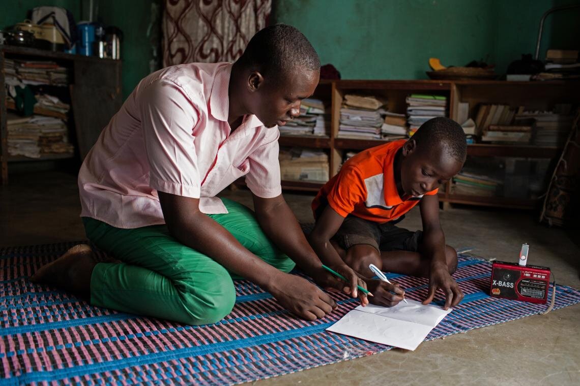 Abdoulaye (left) guides Hussaini through his lesson on 25 June 2019. Abdoulaye says that people have been deeply affected by the crisis. “At first, they only threatened schools,” he says. “Nowadays, they actually kill us.” But he insists that he has not been deterred. “It’s very important for these children to learn,” he says. “They are our younger brothers and sisters. We must help them.”