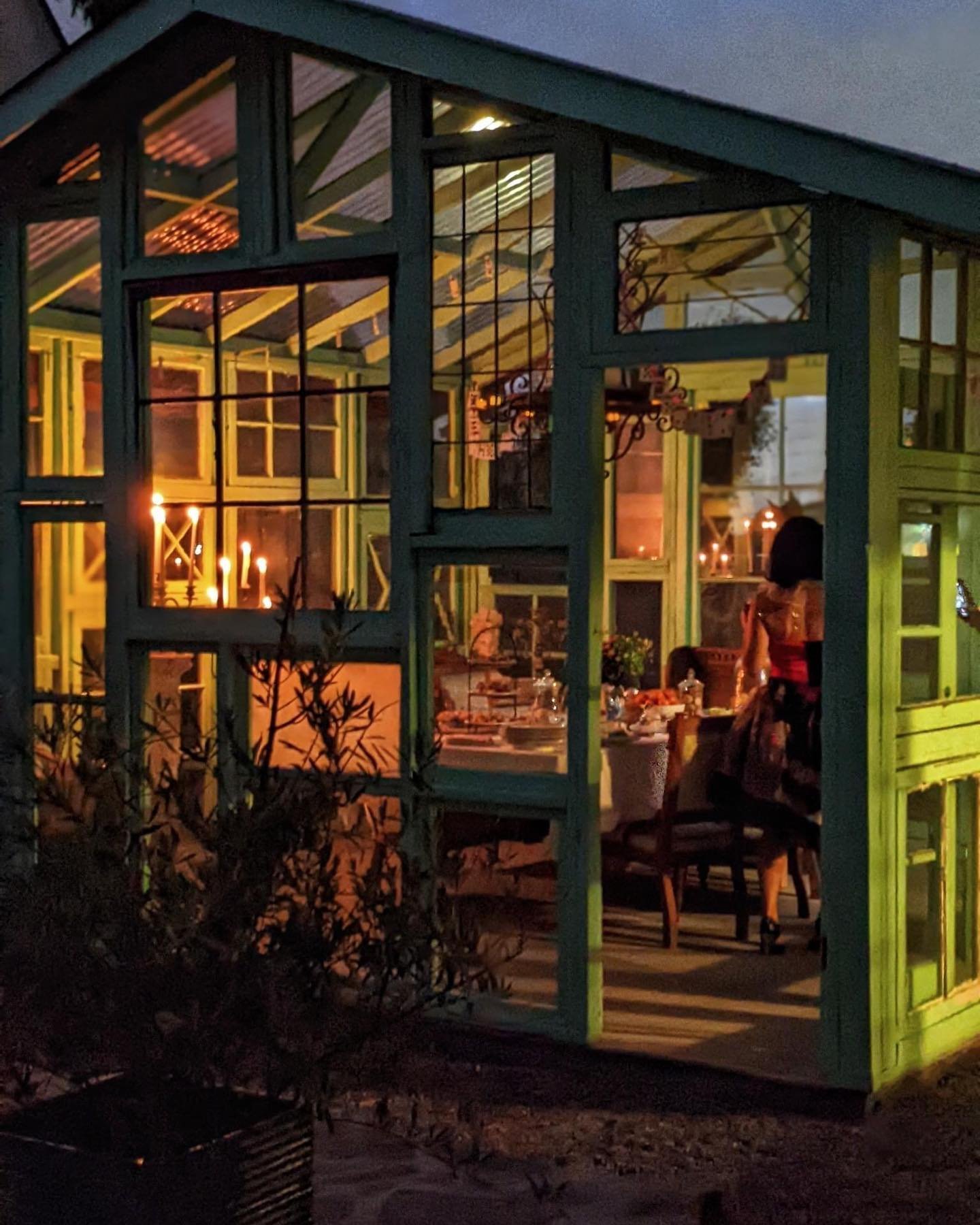 glass window cottage at night.jpg