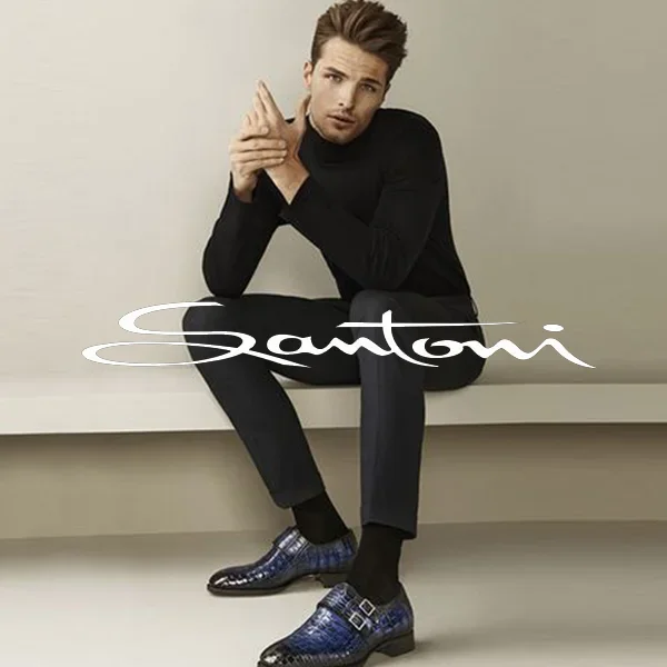 a man wearing Santoni brand shoes, specifically blue leather double-monk straps.