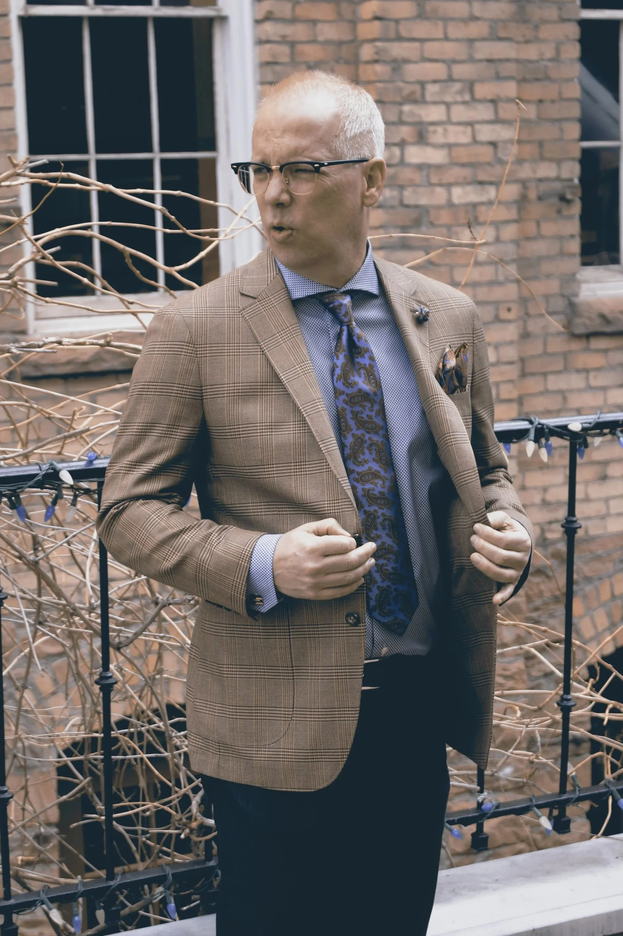 a man wearing a plaid blazer, which is similar to a "London" plaid blazer made of a silk-wool blend.