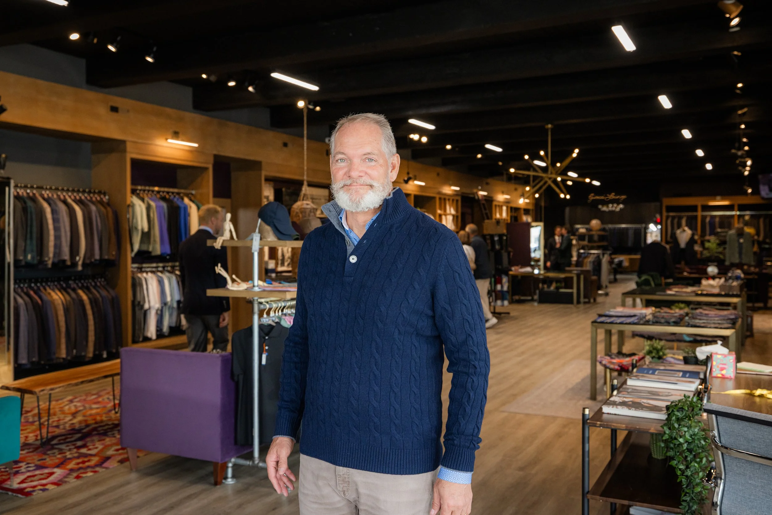 Luxury mens suits on display at UWM Men's Shop, serving Holladay and the Salt Lake Valley, Utah