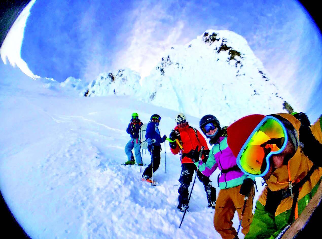 Good friends enjoying two feet of fresh snow from the summit down Leuthold's Couloir (Photo: Asit Rathod)