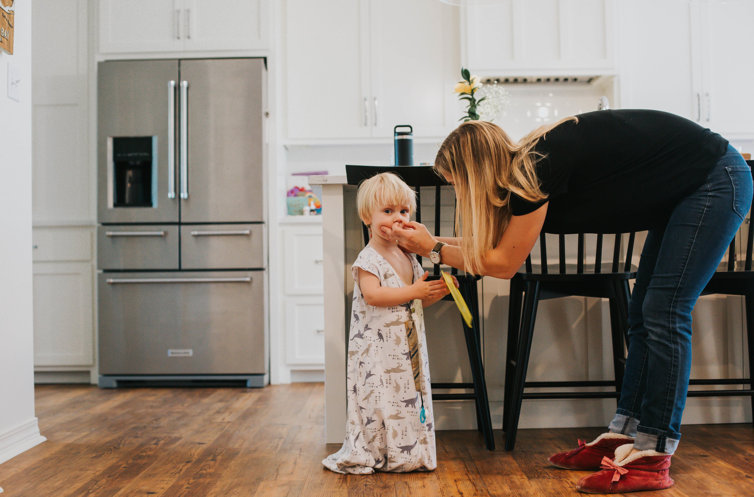 Fairhope mom cleaning baby nose